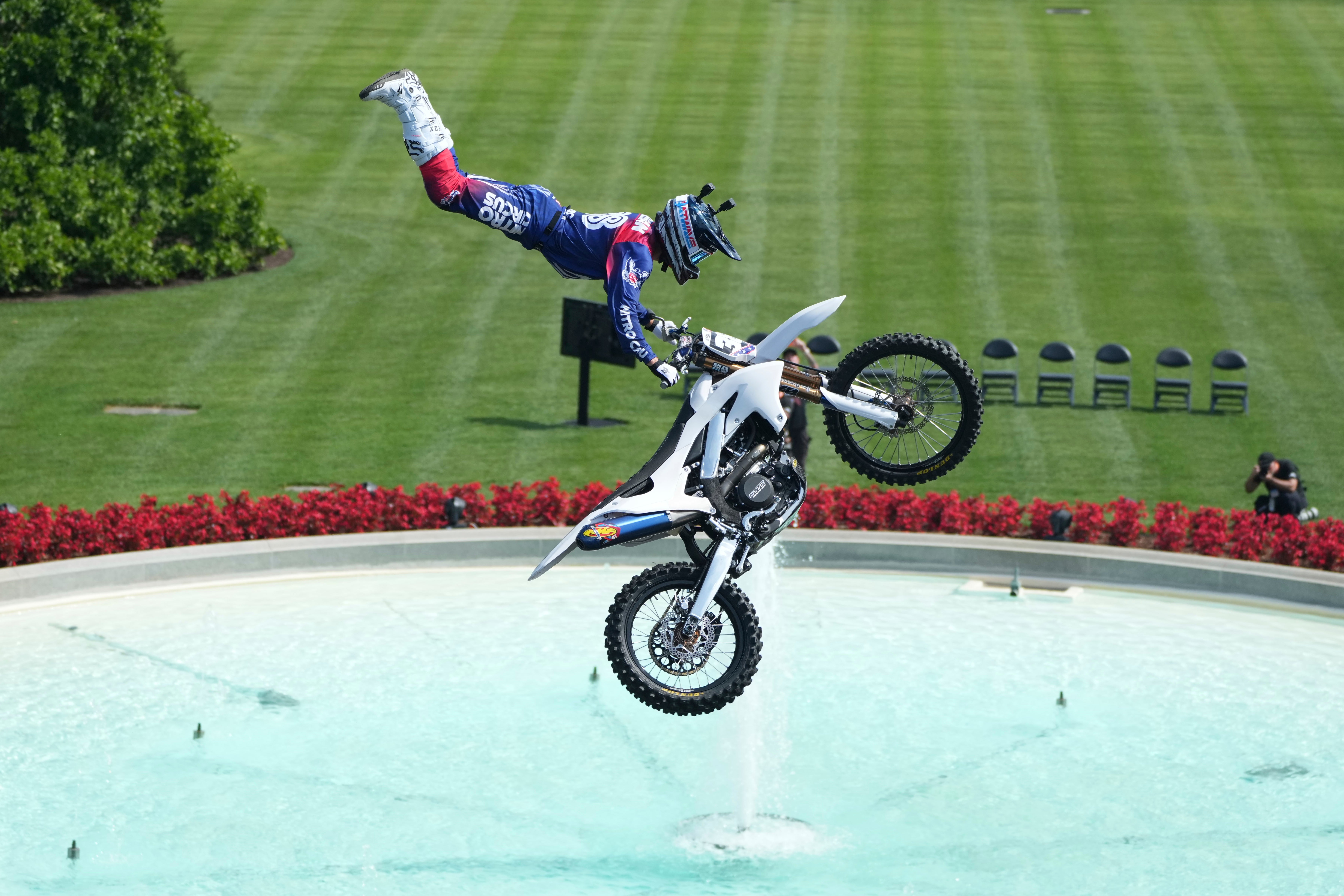 A motor sports athlete and stunt performer does a motorcycle jump ahead of the UFC Freedom 250 fights on the South Lawn of the White House on June 13, 2026 (Getty Images)