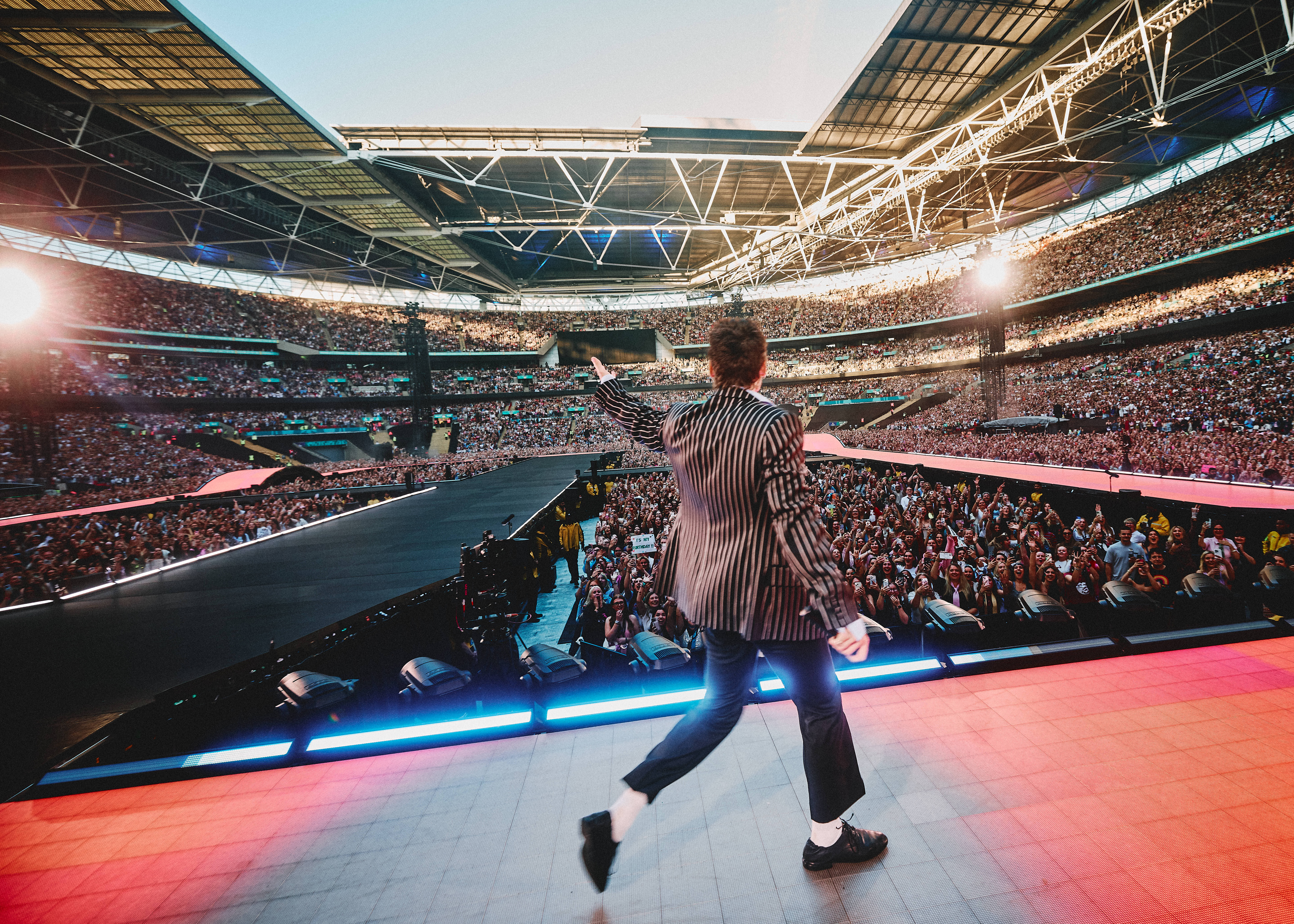 Dance more: Styles does a lap at Wembley Stadium