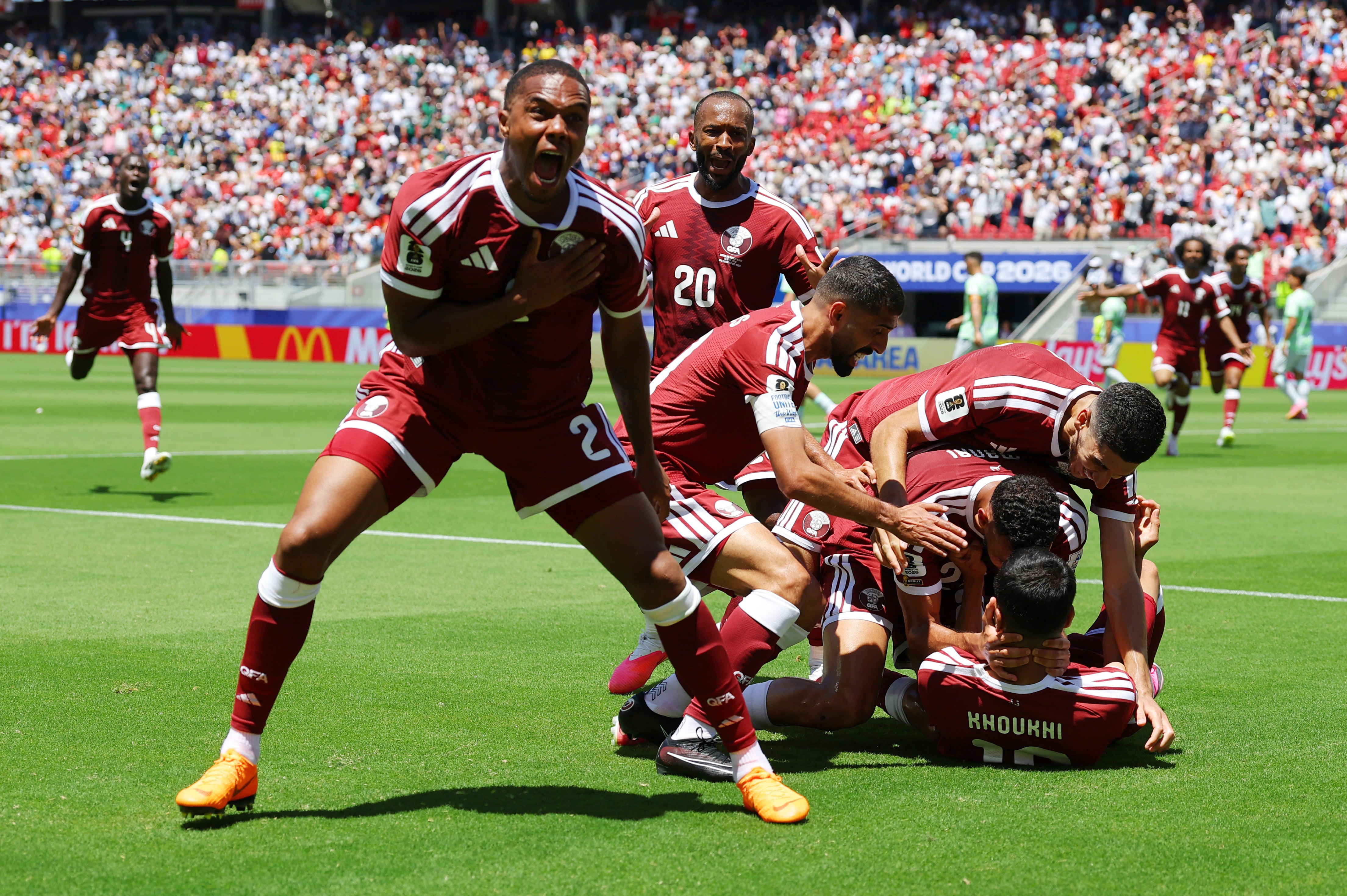 Qatar celebrate their late equaliser against Switzerland