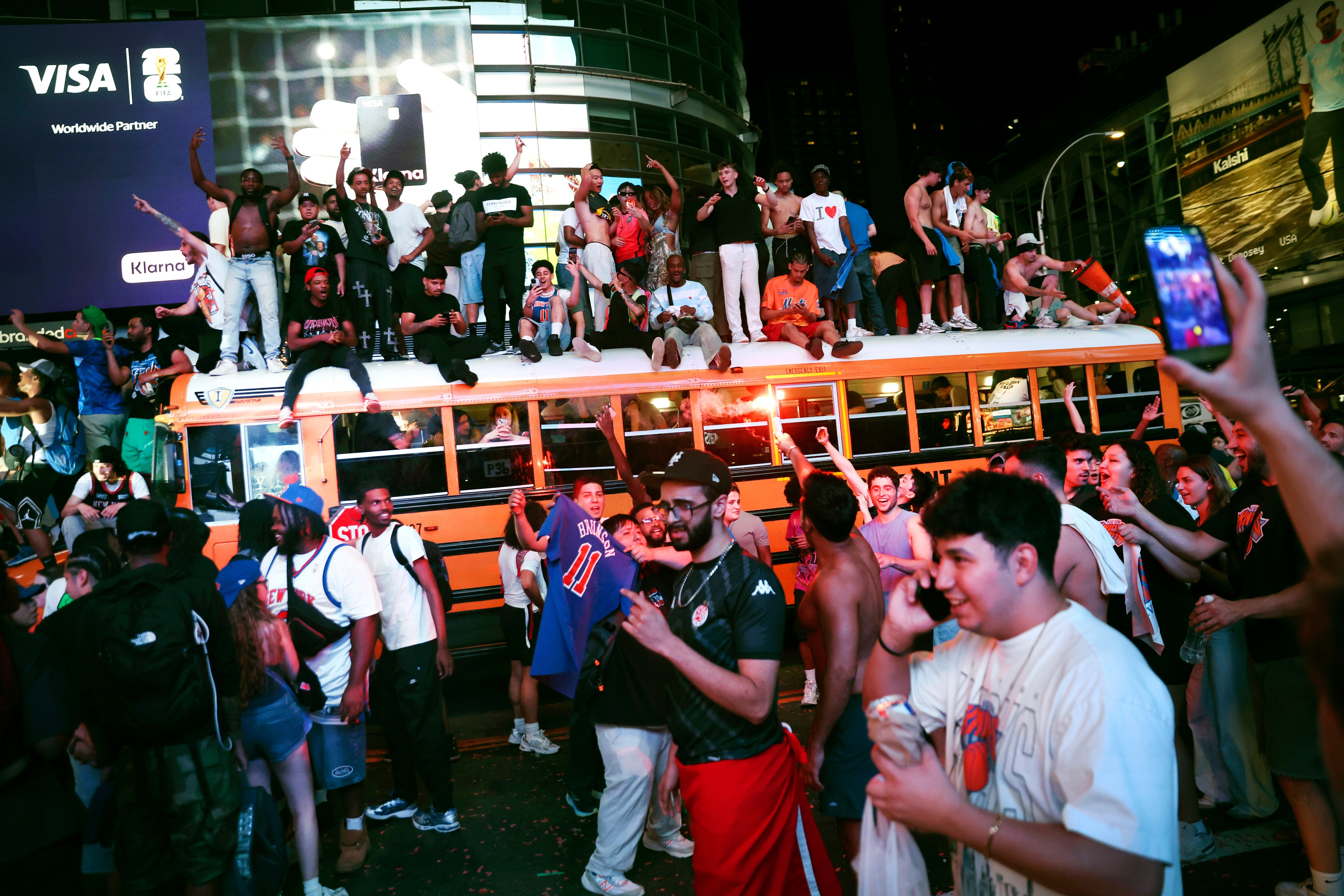 New York Knicks fans celebrate their victory after Game 5 of the NBA Finals basketball series against the San Antonio Spurs
