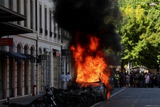 A Tesla car burns during a protest against the upcoming G7 summit in Evian-les-Bains in France