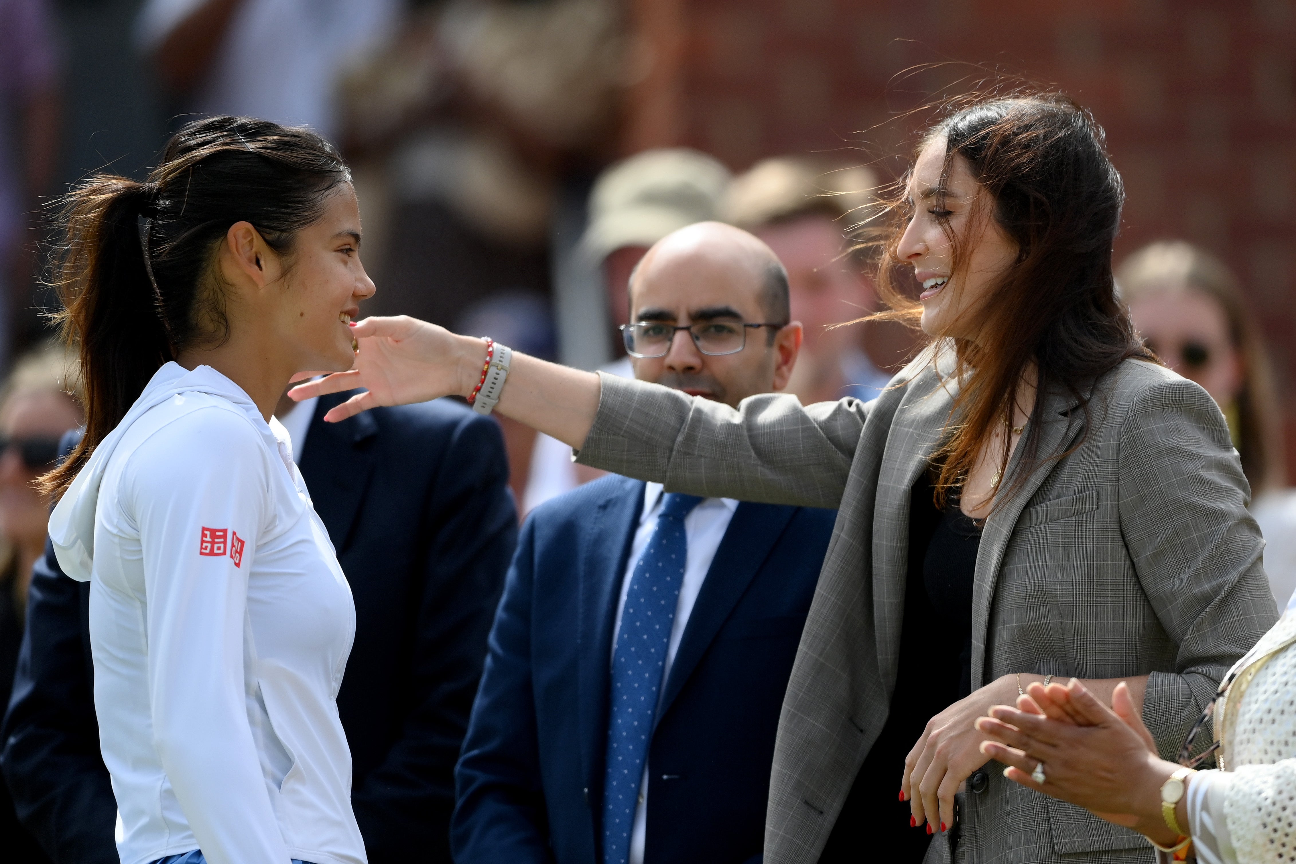 Emma Raducanu of Great Britain is embraced by Laura Robson, Tournament Director of the HSBC Championships
