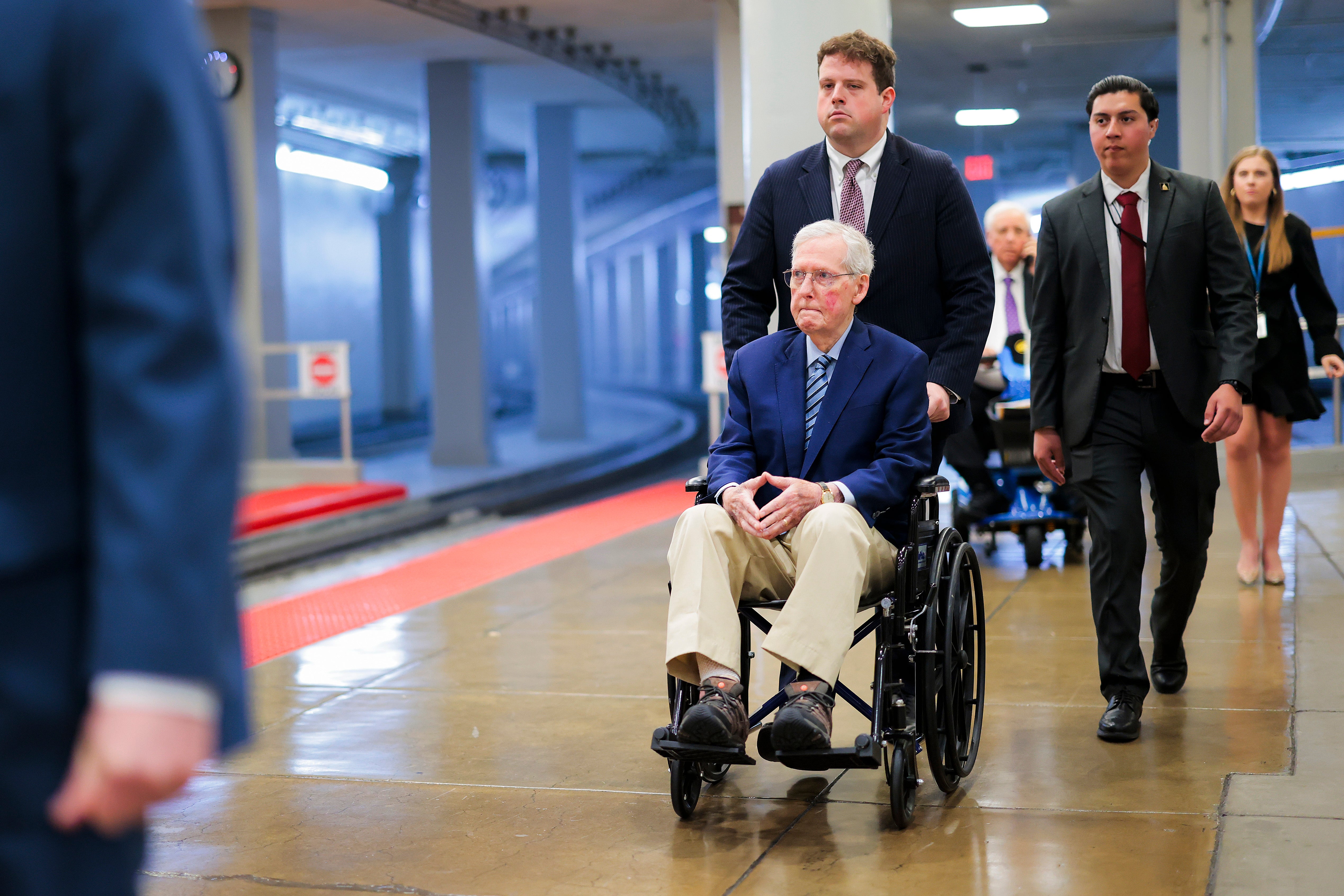McConnel (R-KY) is pushed in a wheelchair through the Senate Subway during the Senate War Powers vote on April 22, 2026 in Washington, DC
