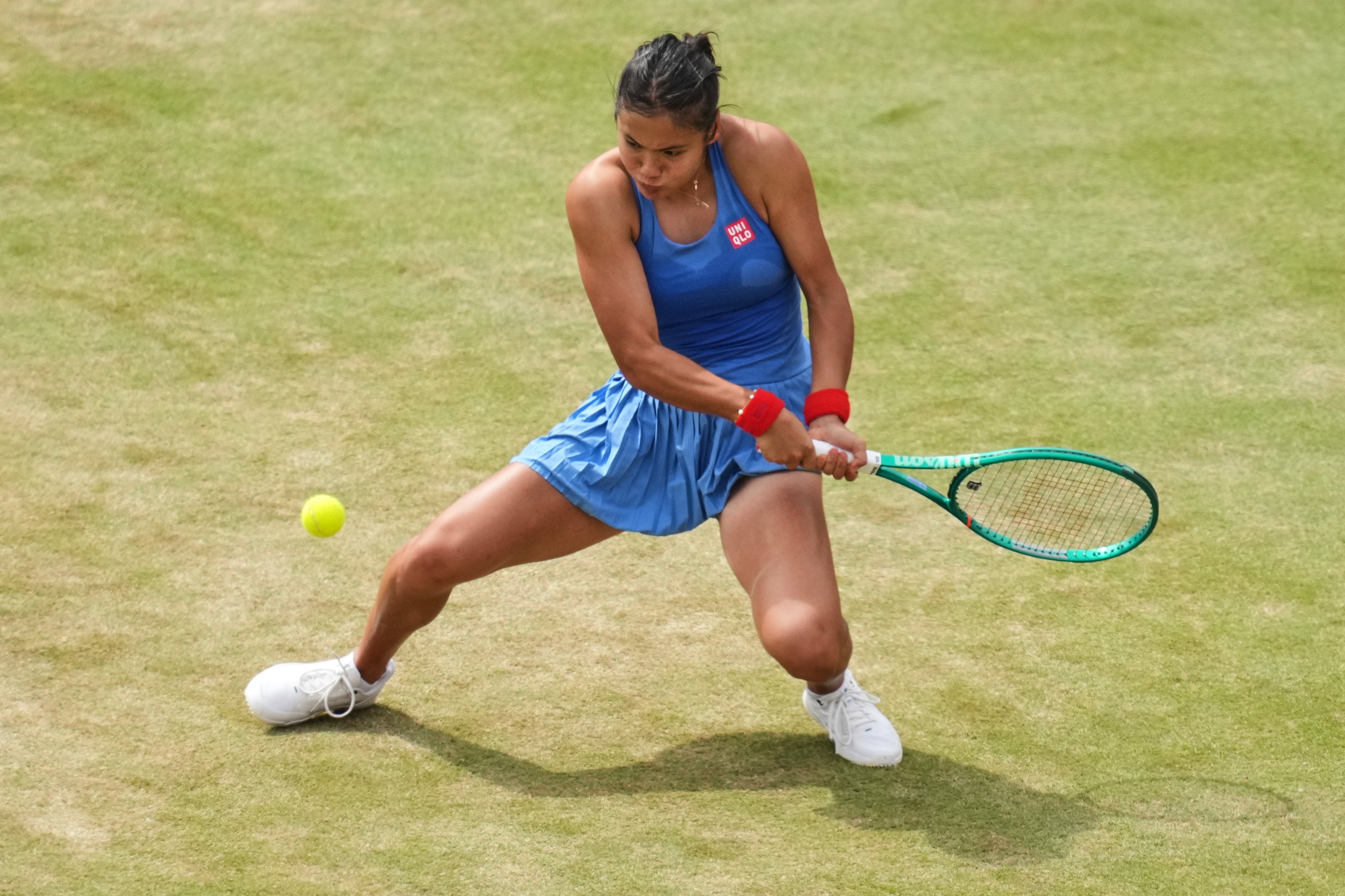 Emma Raducanu of Britain plays a return to Donna Vekic of Croatia during the women's final