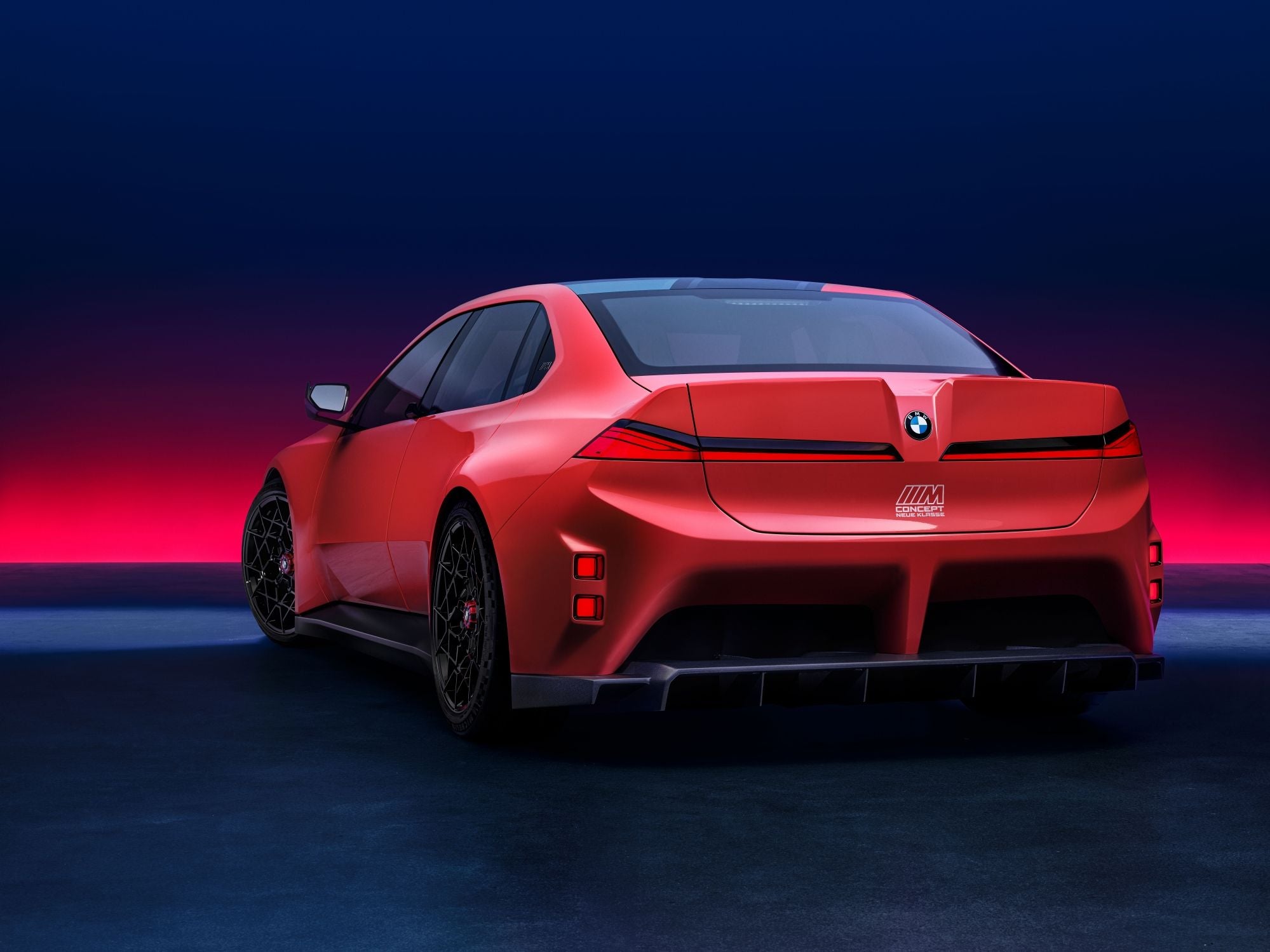 The BMW M Concept Neue Klasse looks even more dramatic at the rear with a huge diffuser and pronounced ducktail spoiler (BMW)