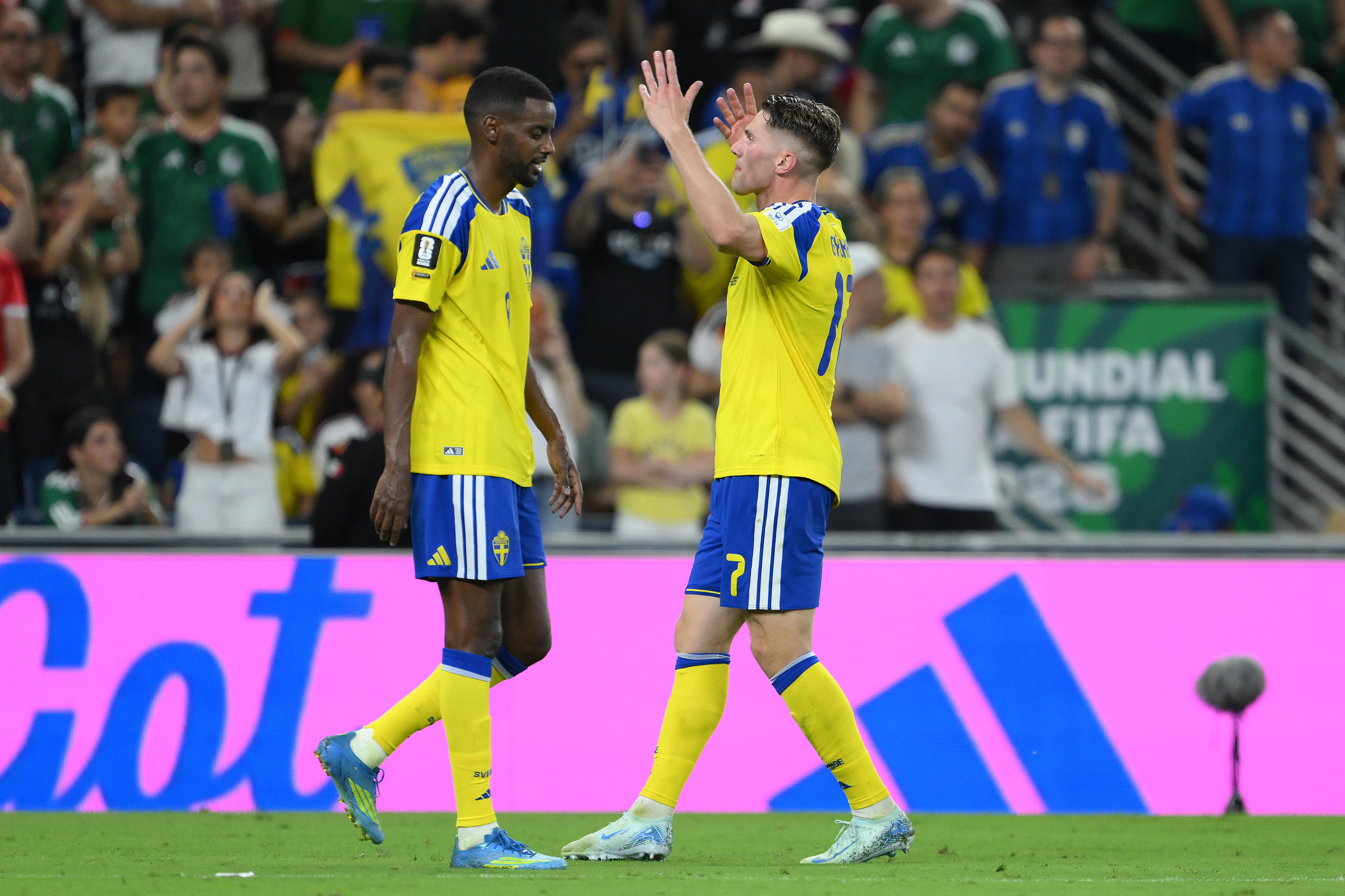 Viktor Gyokeres and Alexander Isak celebrate