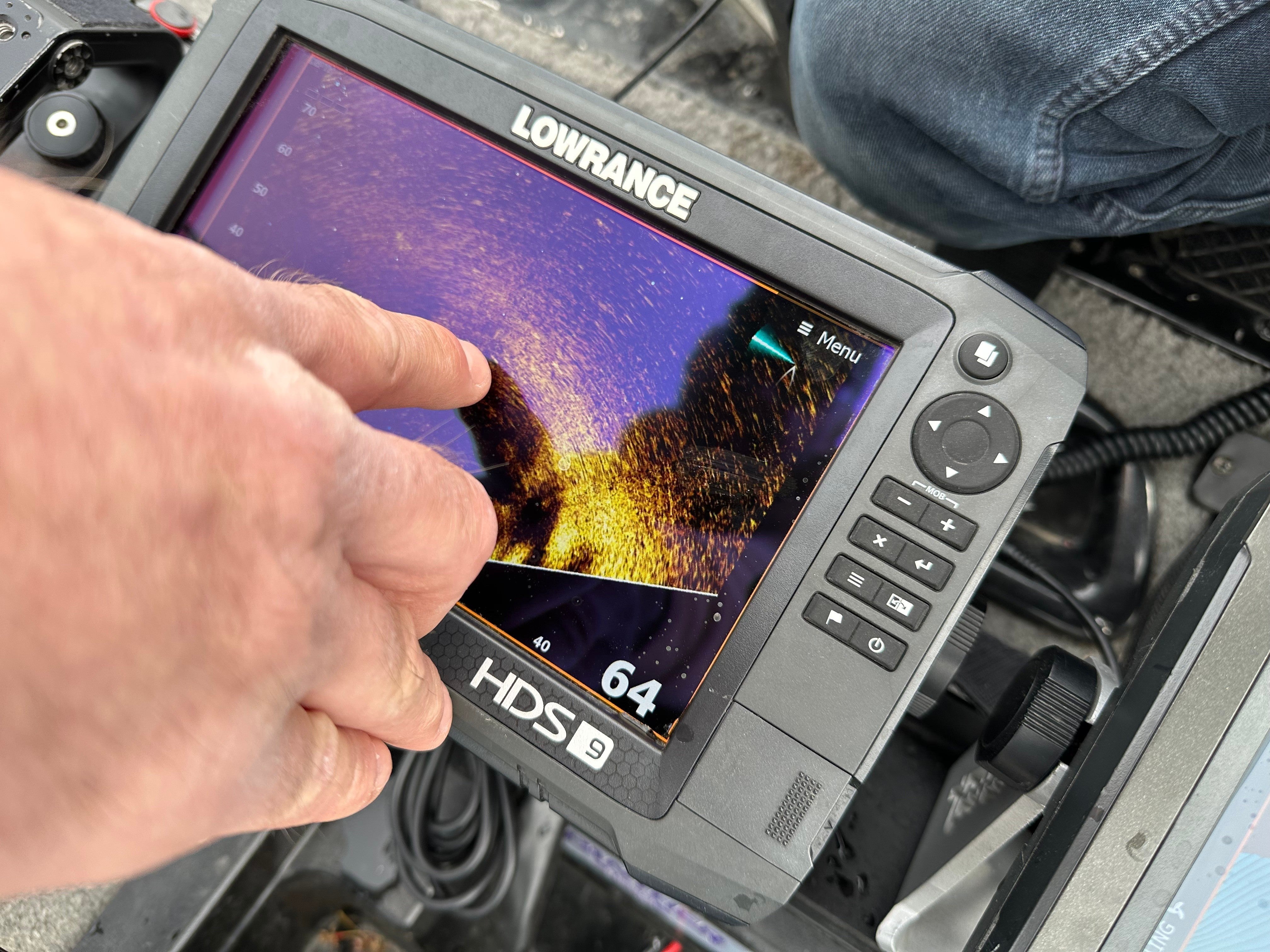 Terry Rehm points out a fish on his forward looking sonar system (AP)