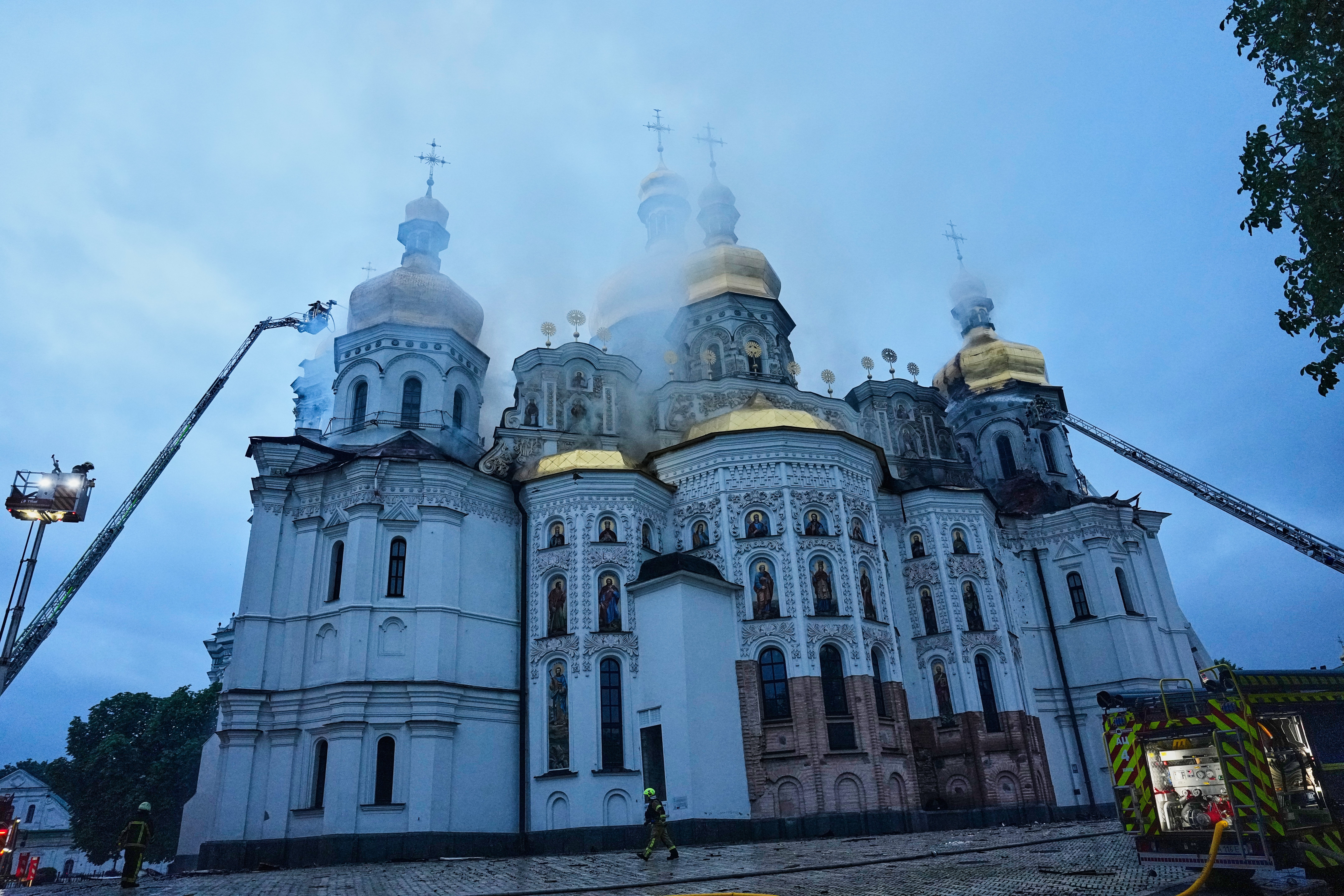 Rescue workers tries to put out a fire at the Kyiv-Pechersk Lavra, also known as the Monastery of the Caves, following a Russian strike in Kyiv (AP)