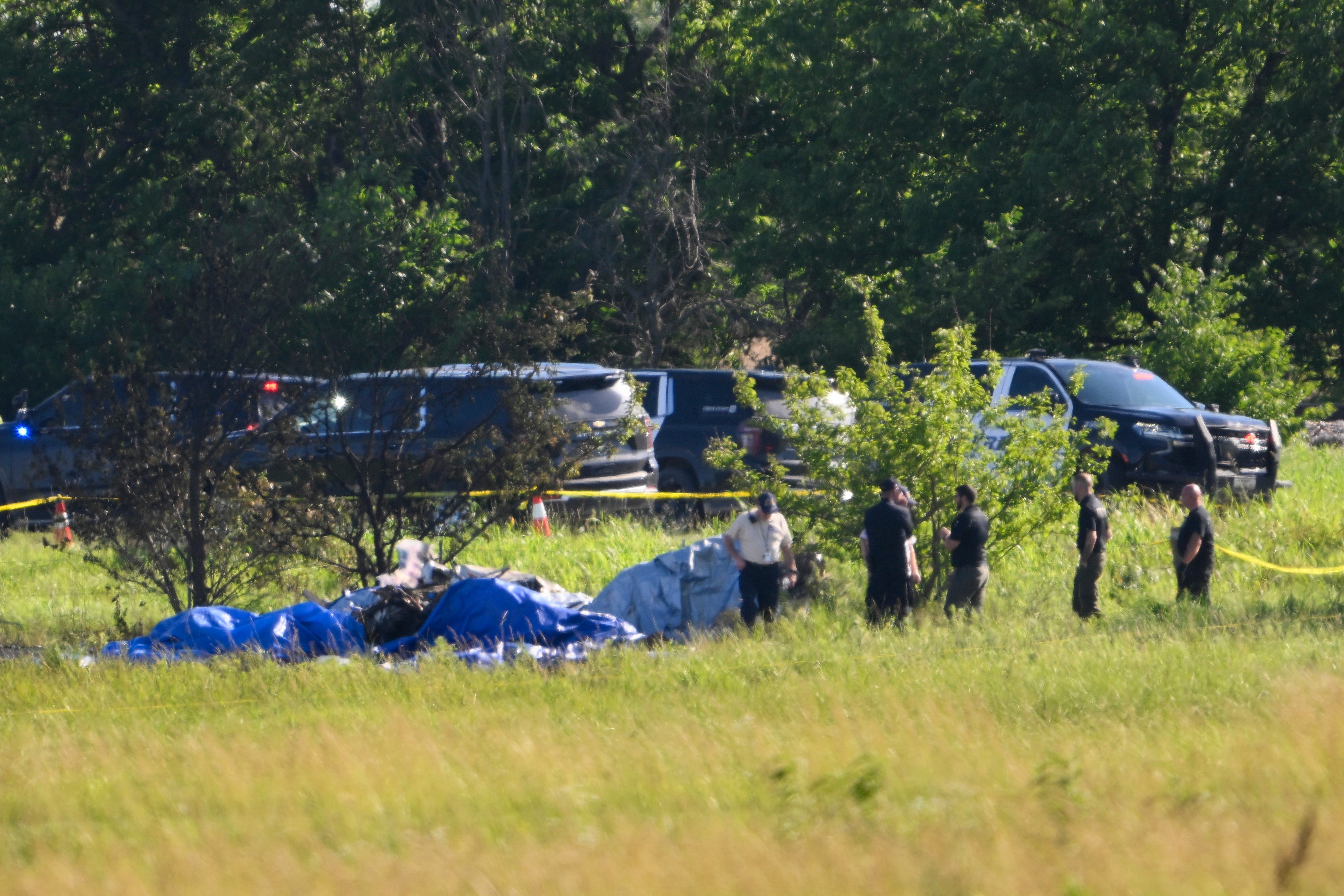 The single-engine turboprop aircraft crashed shortly after takeoff from Butler Memorial Airport, about an hour south of Kansas City. Authorities said all 12 people aboard were killed as family members watched from the ground