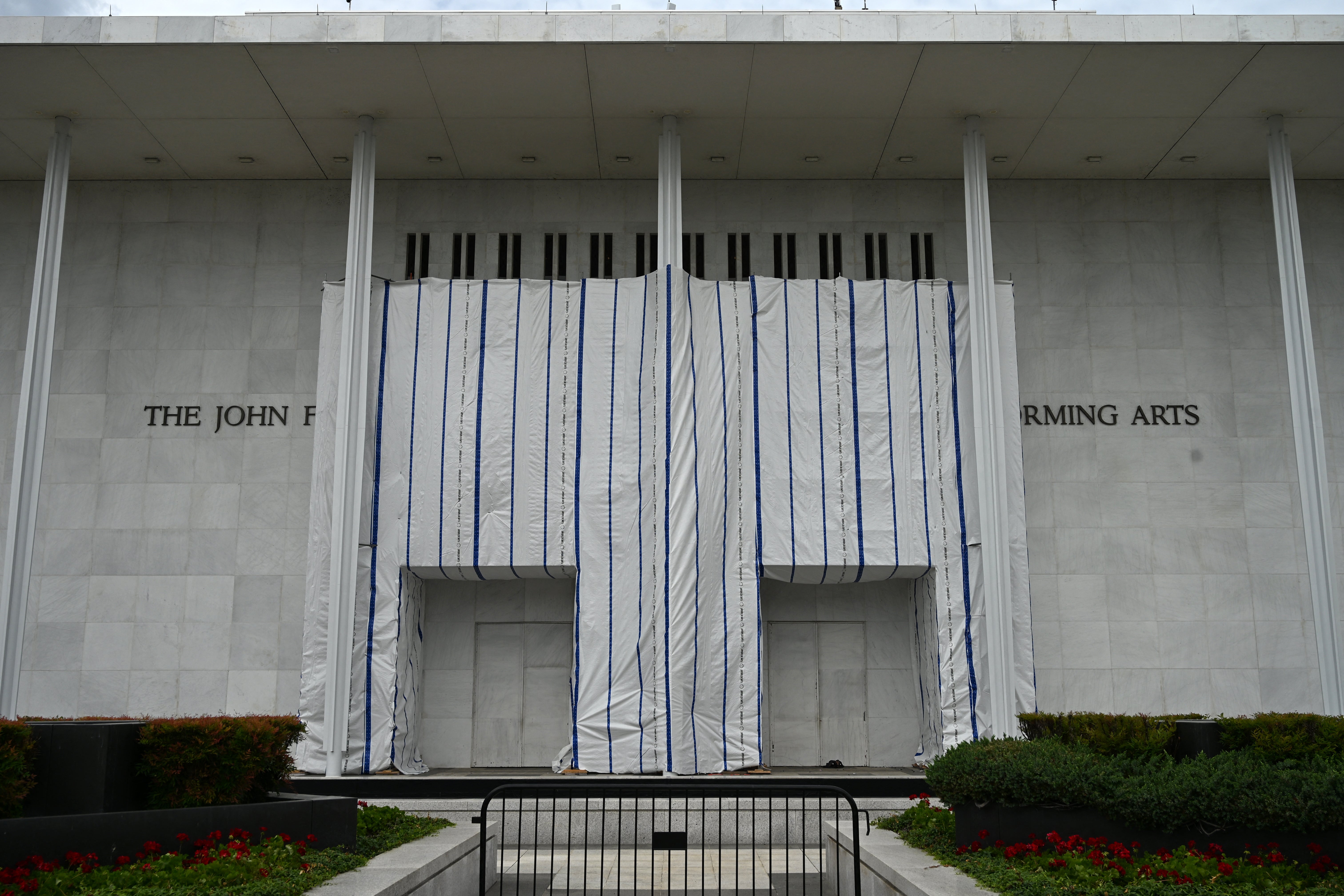 The Kennedy Center is now shrouded in scaffolding after Donald Trump's name was taken off of the memorial