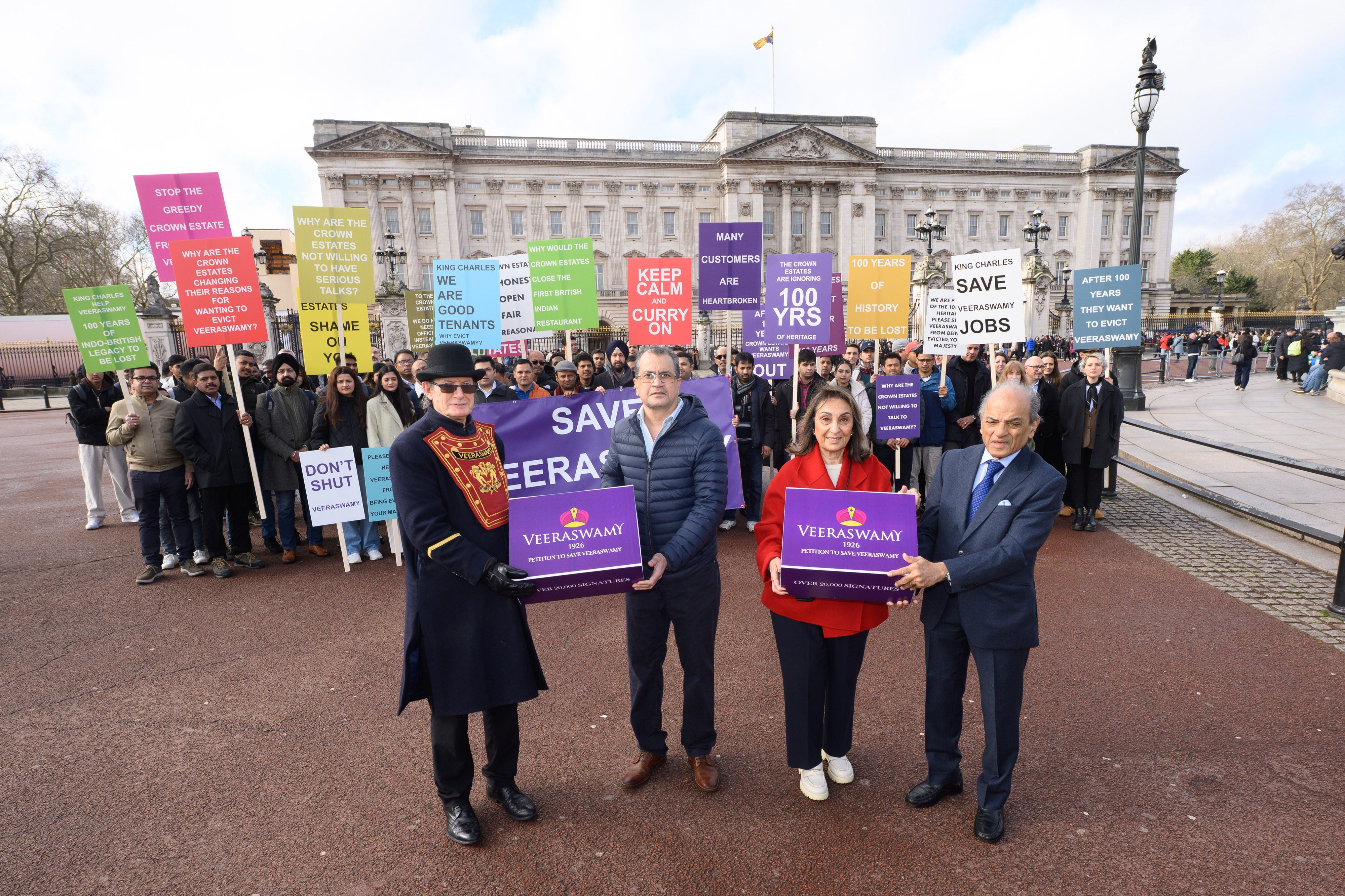 Campaigners delivering a 20,000-signature petition to Buckingham Palace in London, requesting King Charles III to intervene (PA)