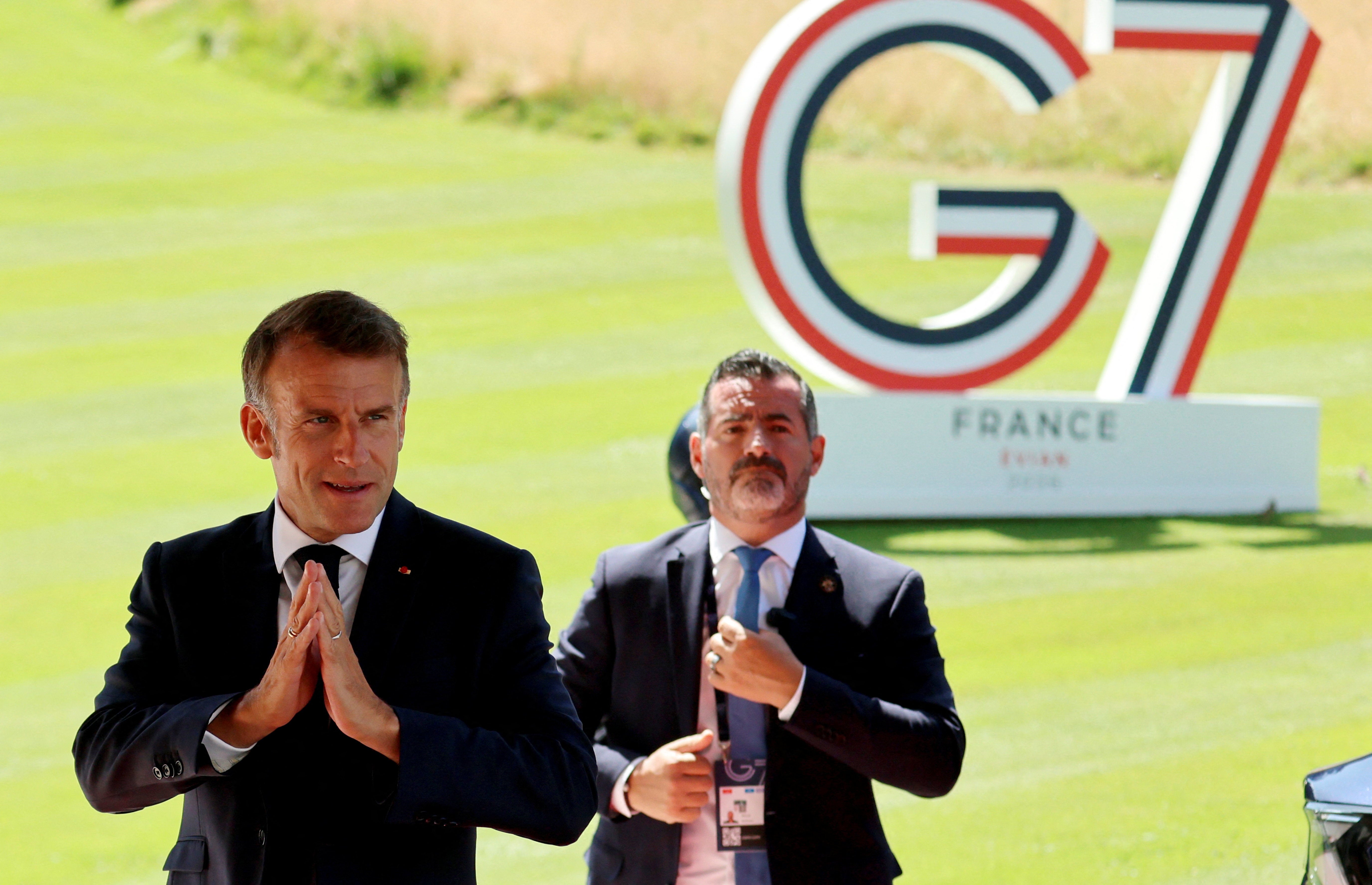 France's President Emmanuel Macron arrives at the Hotel Royal ahead of the start of the G7 summit, in Evian, France, June 15, 2026. LUDOVIC MARIN/Pool via REUTERS