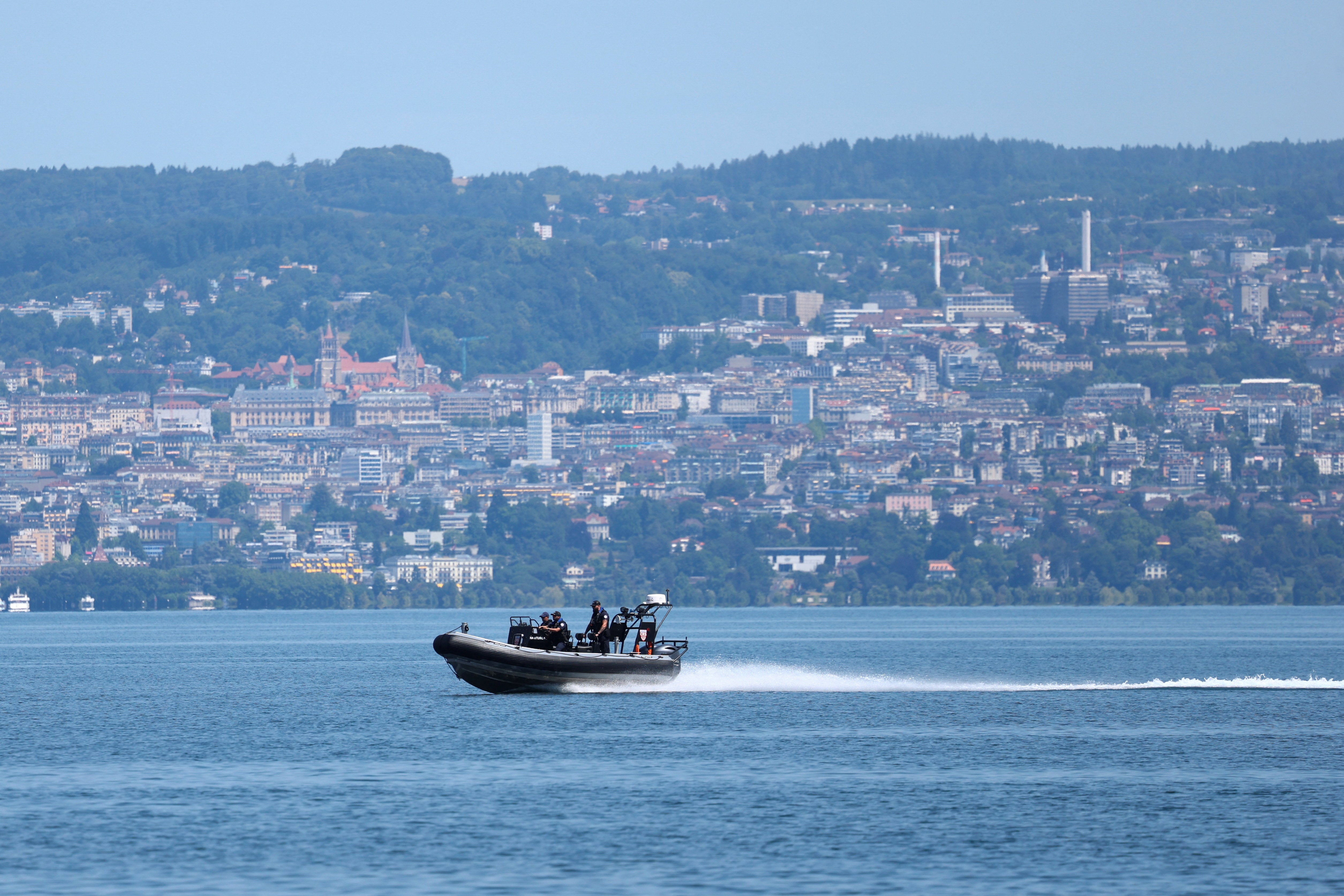 A French police boat patrols on Lake Geneva in front of the Swiss city of Lausanne on the opening day of the G7 summit in Evian-les-Bains, France, June 15, 2026. REUTERS/Denis Balibouse