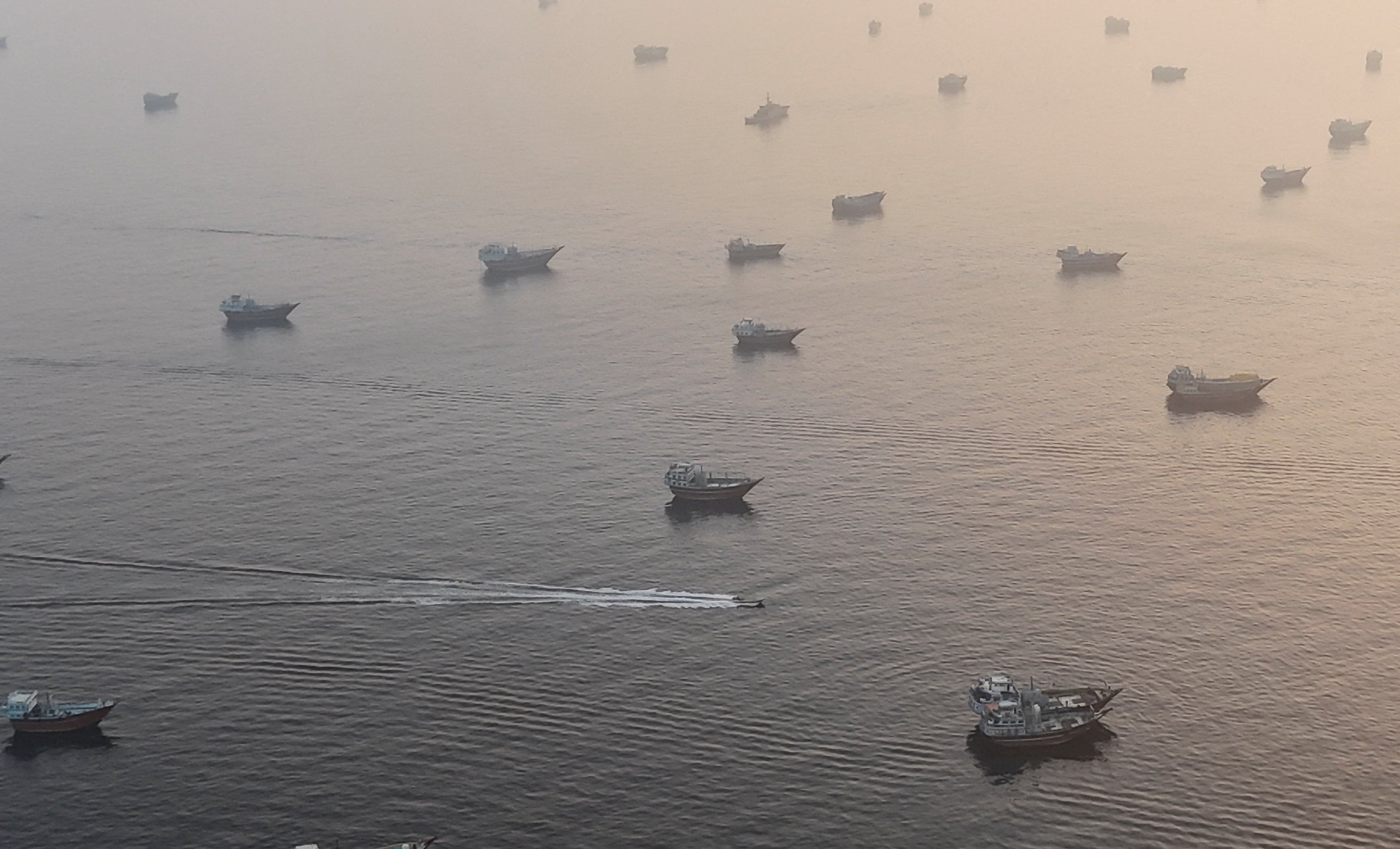 A drone view shows vessels in the Strait of Hormuz, as seen from Musandam, Oman, June 15