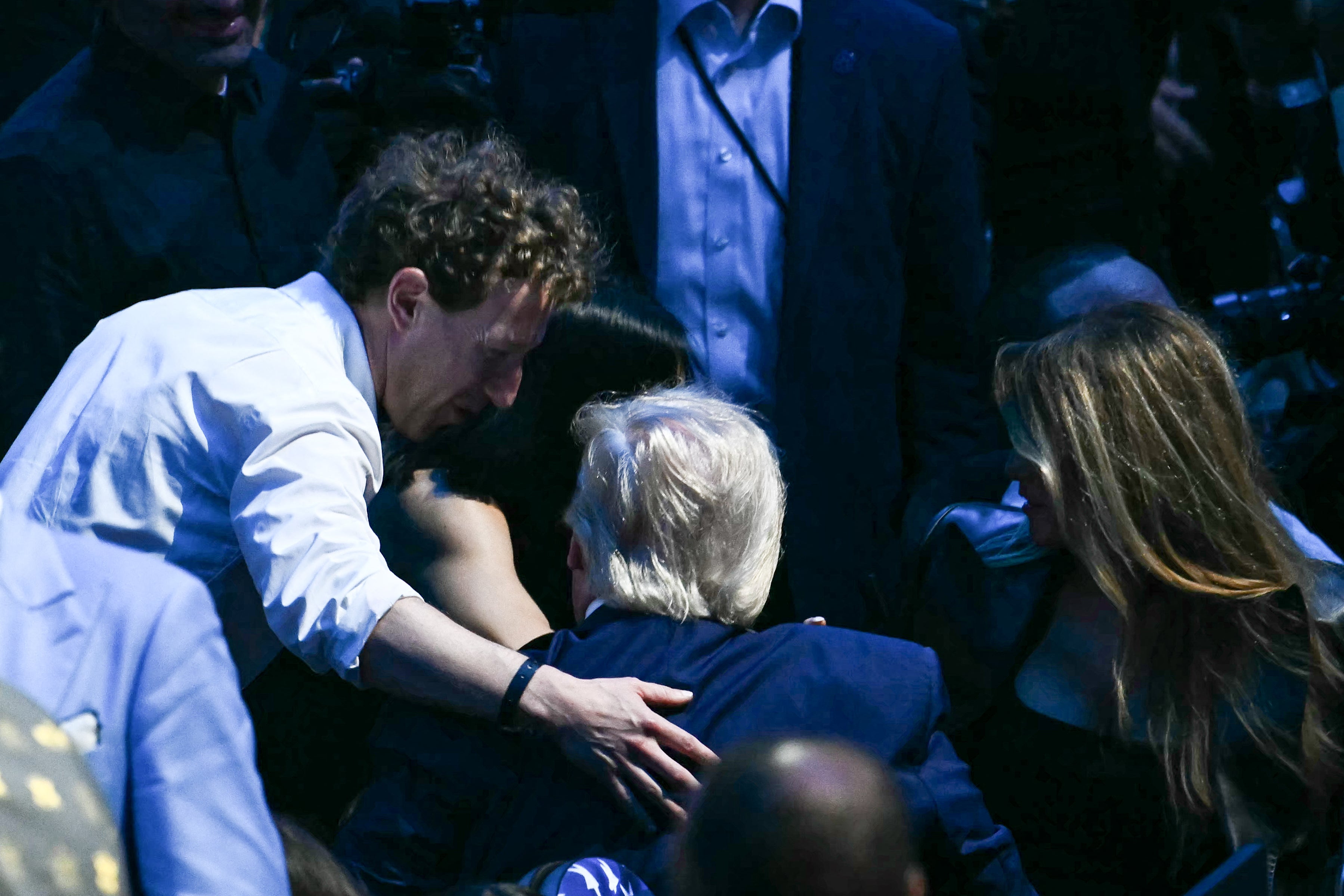 Mark Zuckerberg speaks with President Donald Trump and first lady Melania Trump at the White House's UFC event