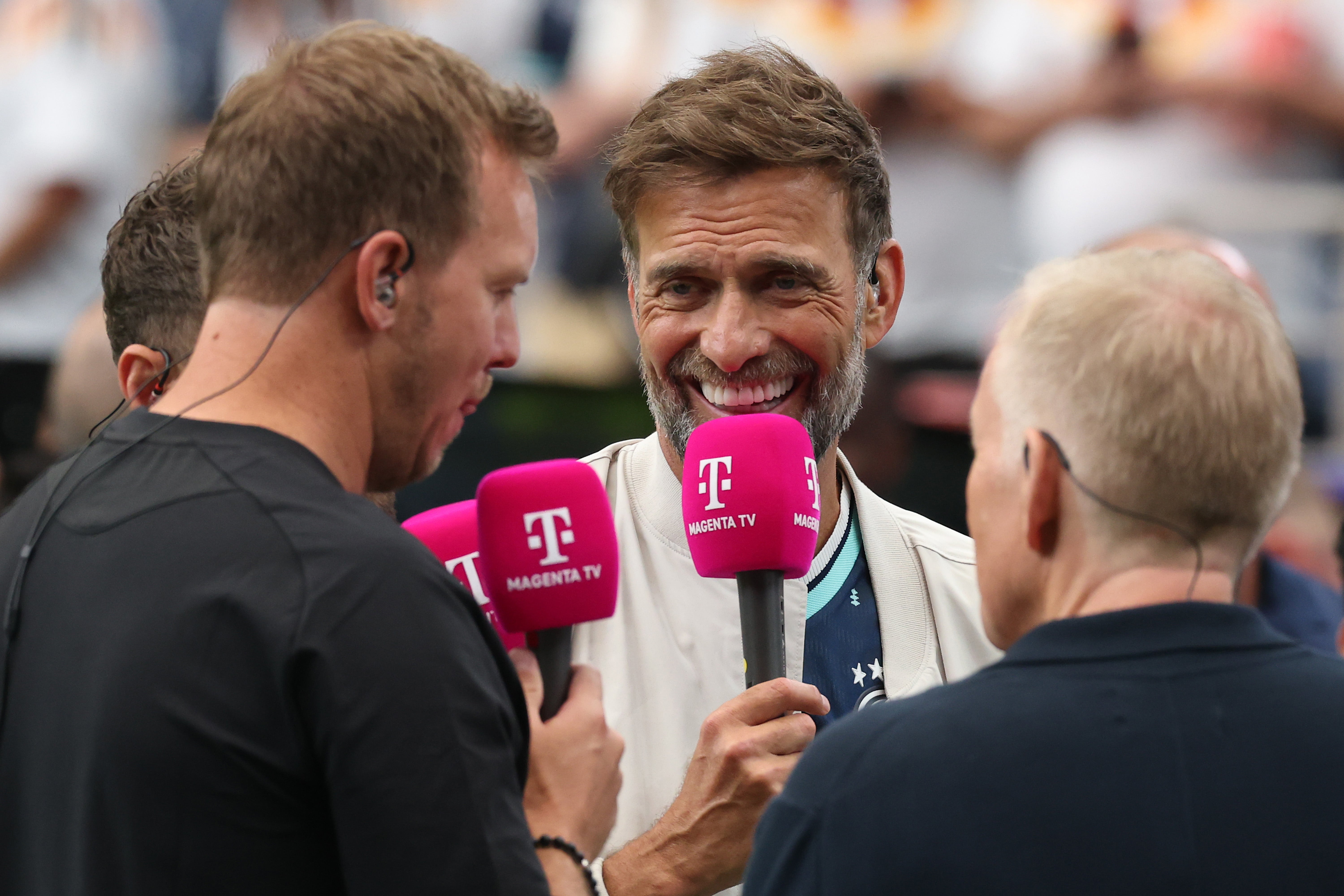 Jurgen Klopp speaks to former Germany manager Julian Nagelsmann while a pundit at the World Cup