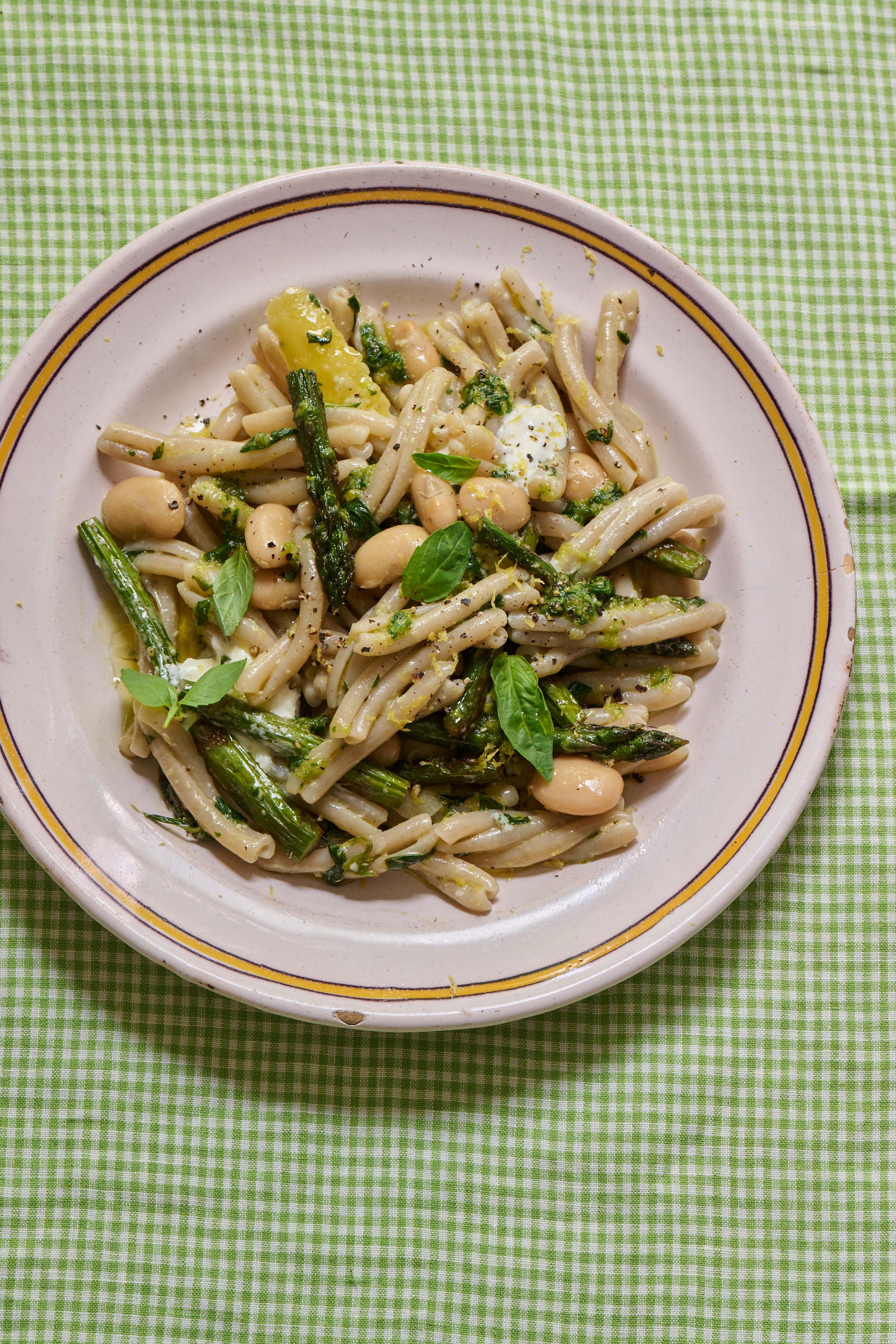 A spring pasta packed with asparagus, butter beans, burrata and pesto