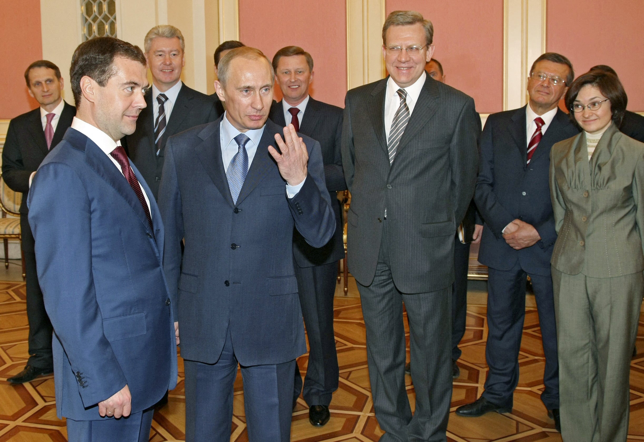 Elvira Nabiullina Nabiullina looks on as Vladimir Putin speaks with Dmitry Medvedev in Moscow in 2008