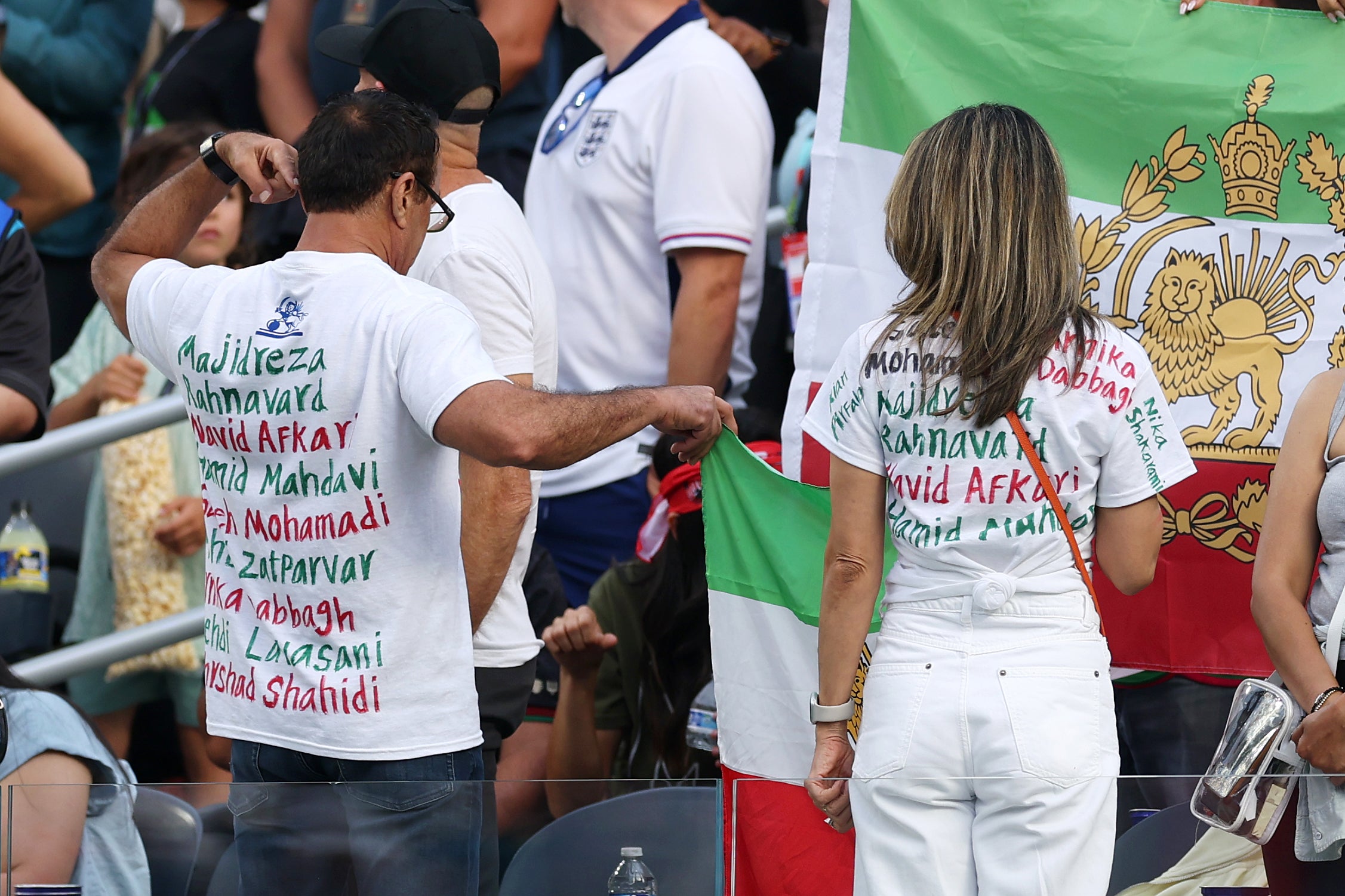 Fans turn their back on the pitch during the national anthems during the FIFA World Cup 2026 Group G match between Iran and New Zealand at Los Angeles Stadium on June 15