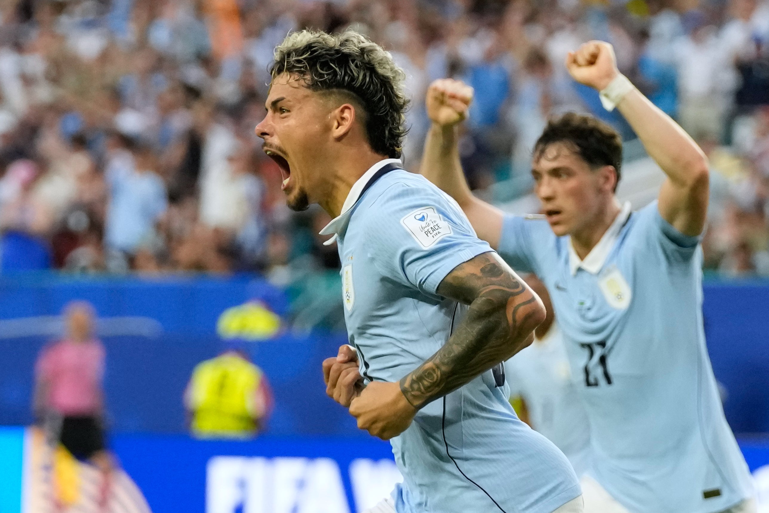 Uruguay's Maxi Araujo celebrates scoring his side's equaliser against Saudi Arabia