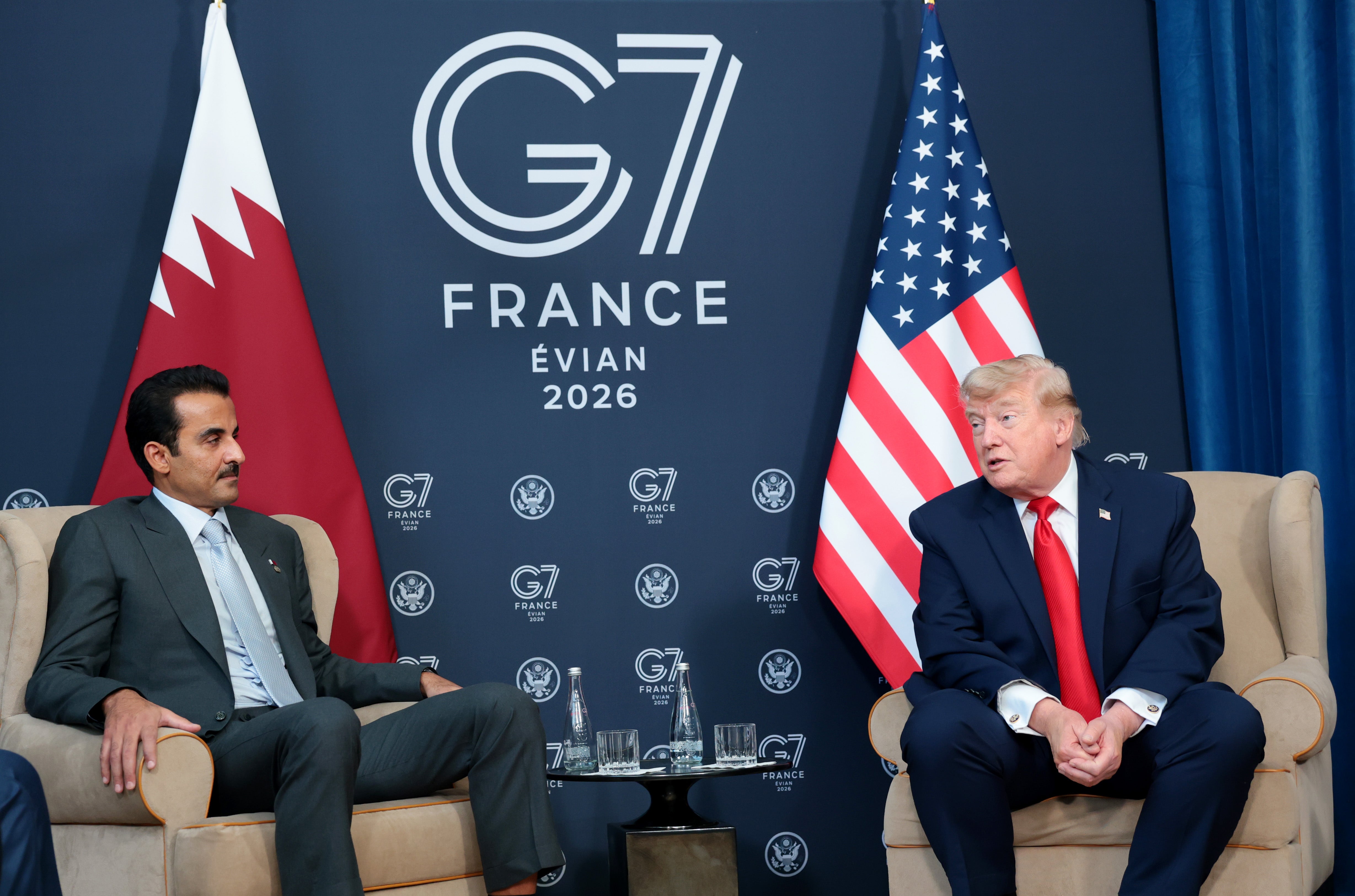 Donald Trump (R) participates in a bilateral meeting with the Emir of Qatar, Sheikh Tamim bin Hamad Al Thani (L) on June 16, 2026 in Evian-les-Bains