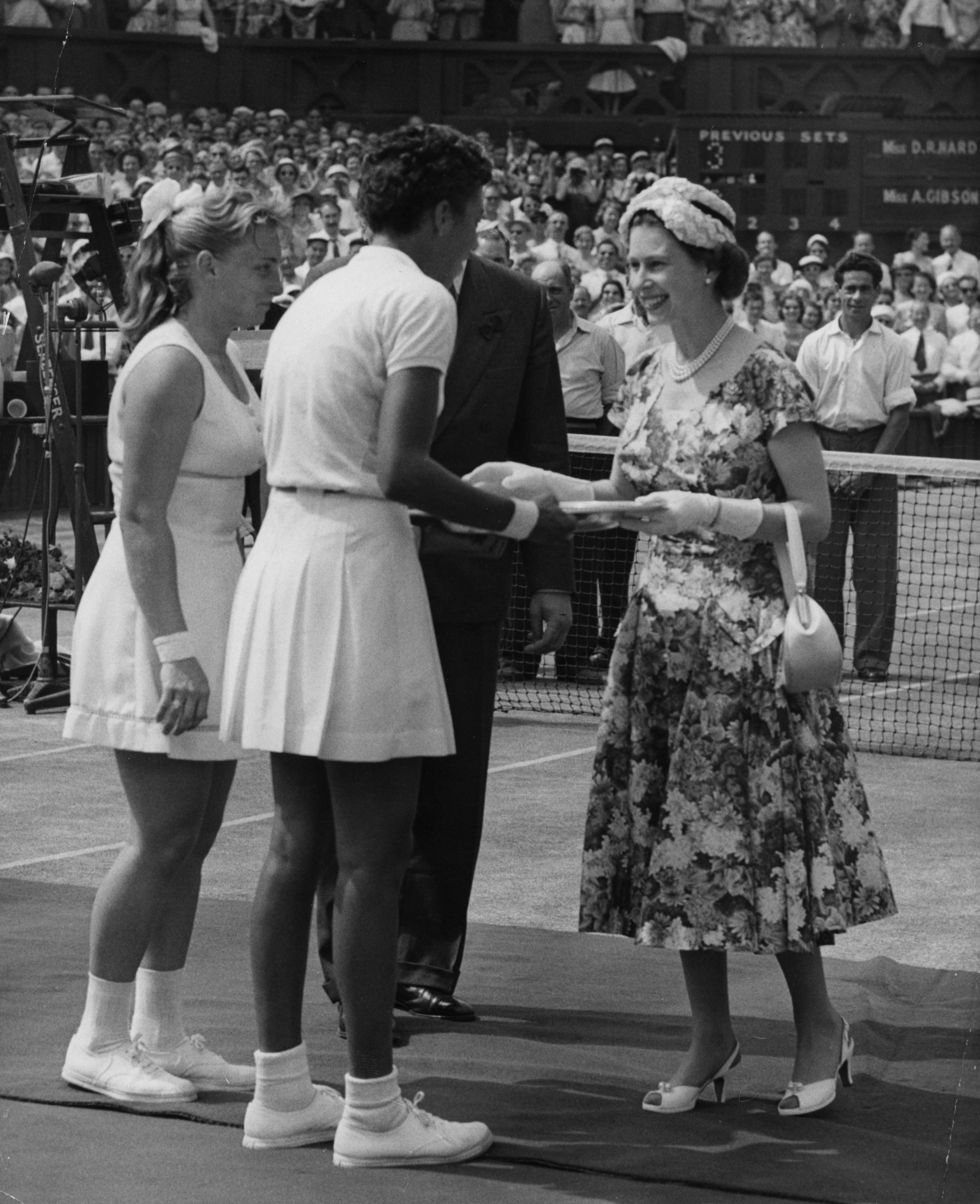 The late Queen at Wimbledon in 1957 (PA)
