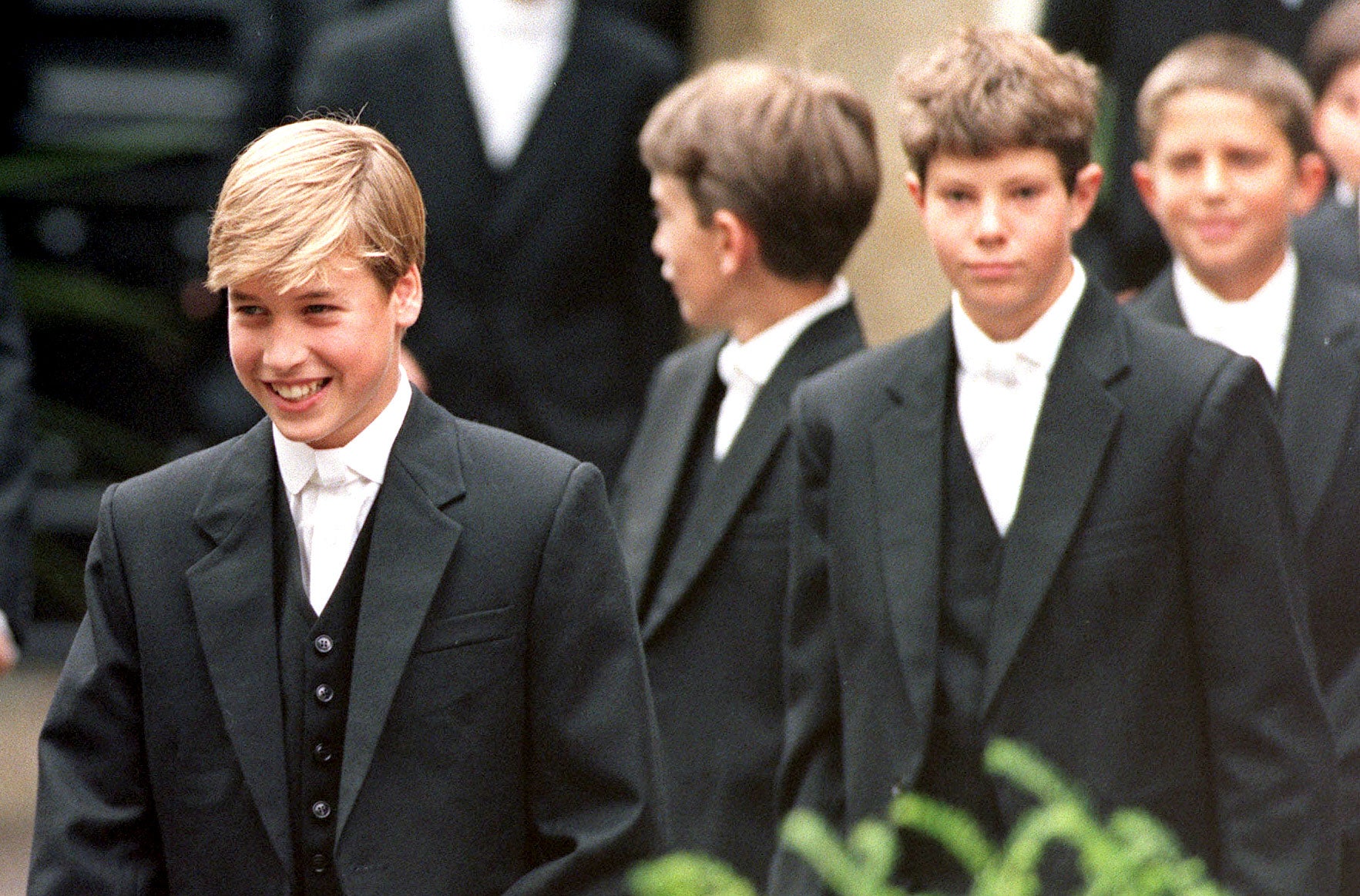 Prince William (now the Prince of Wales) leads his classmates to lessons on his first day at Eton School
