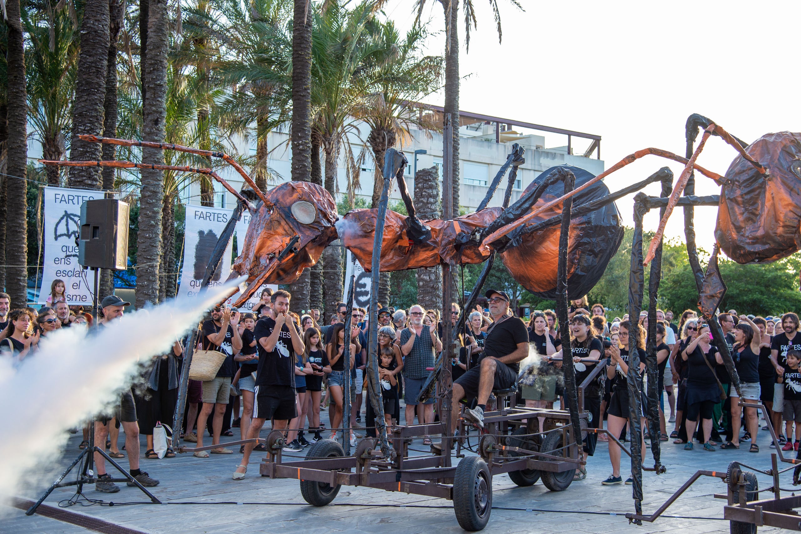 Giant ant puppets swarm streets of Spanish island in anti-tourism protest