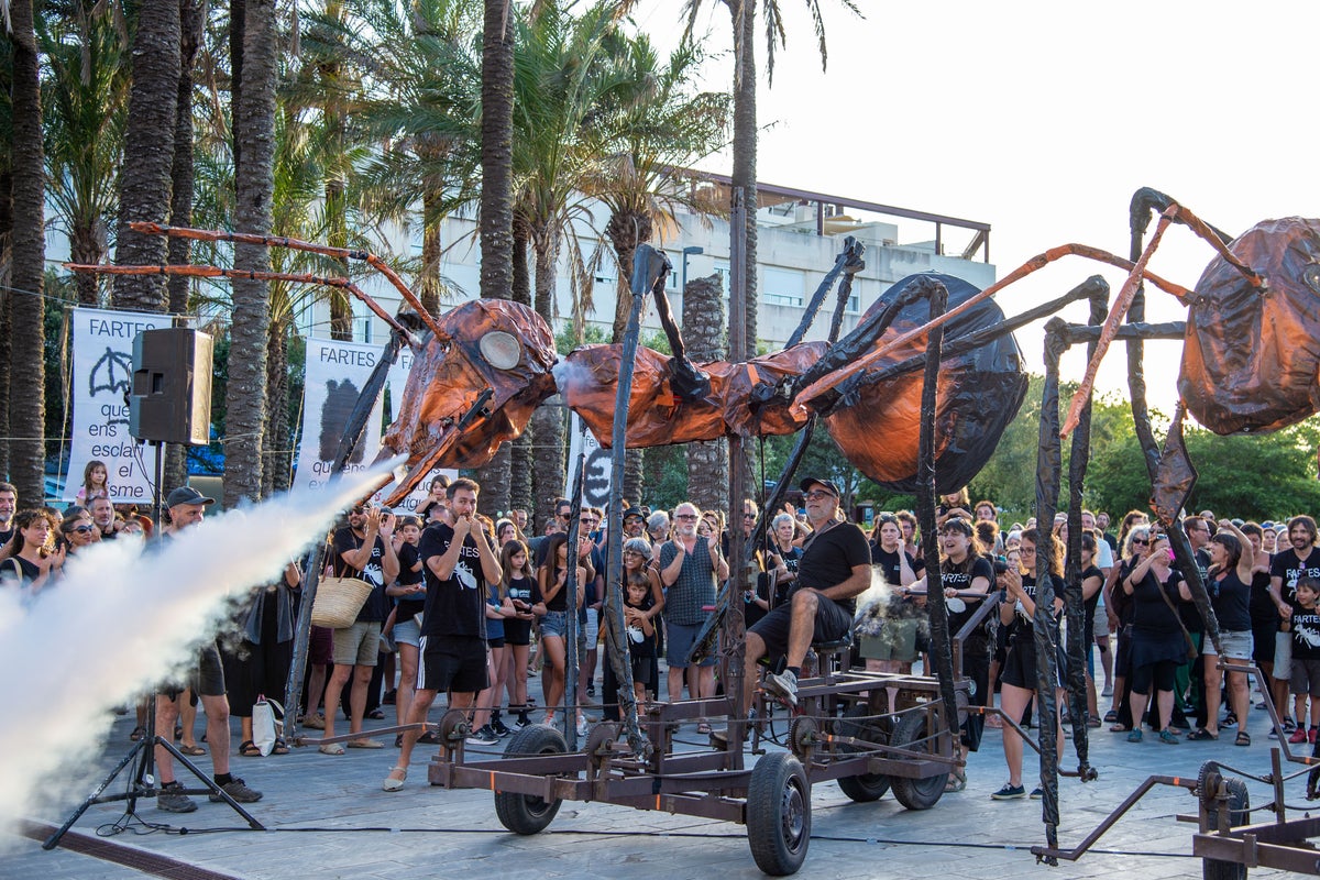 Giant ant puppets swarm streets of Spanish island in anti-tourism protest Giant ant puppets swarm streets of Spanish island in anti-tourism protest