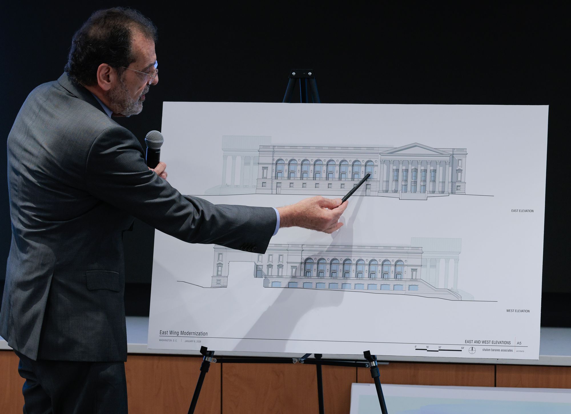The proposed 90,000-square-foot venue would dwarf the main White House building. Pictured here, architect Shalom Baranes shows elevation drawings for the ballroom to members of the National Capital Planning Commission on January 08, 2026 in Washington, DC. (Getty Images)