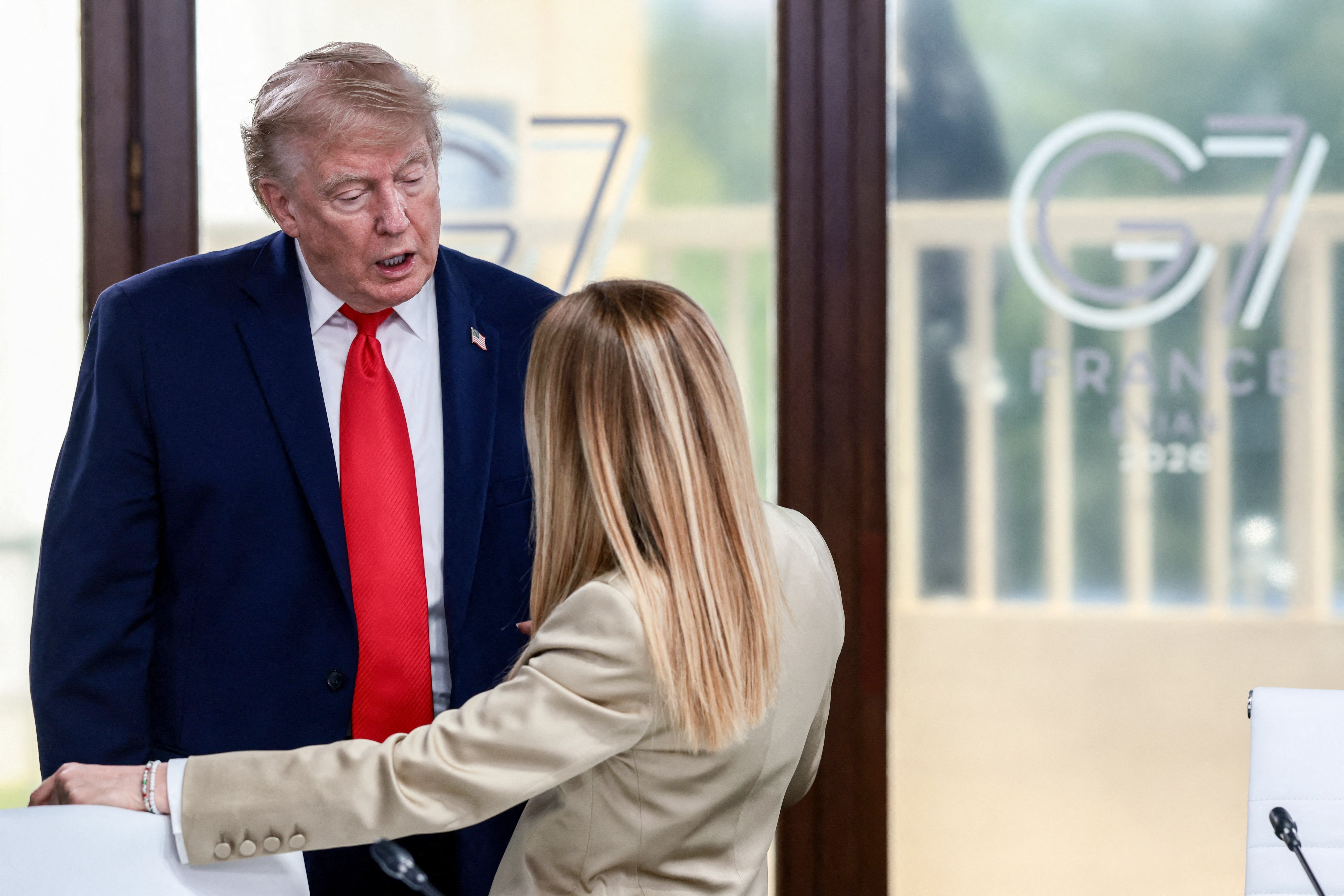 Trump insinuated that the Italian PM had been eager to take a picture, which she denied (AFP/Getty)