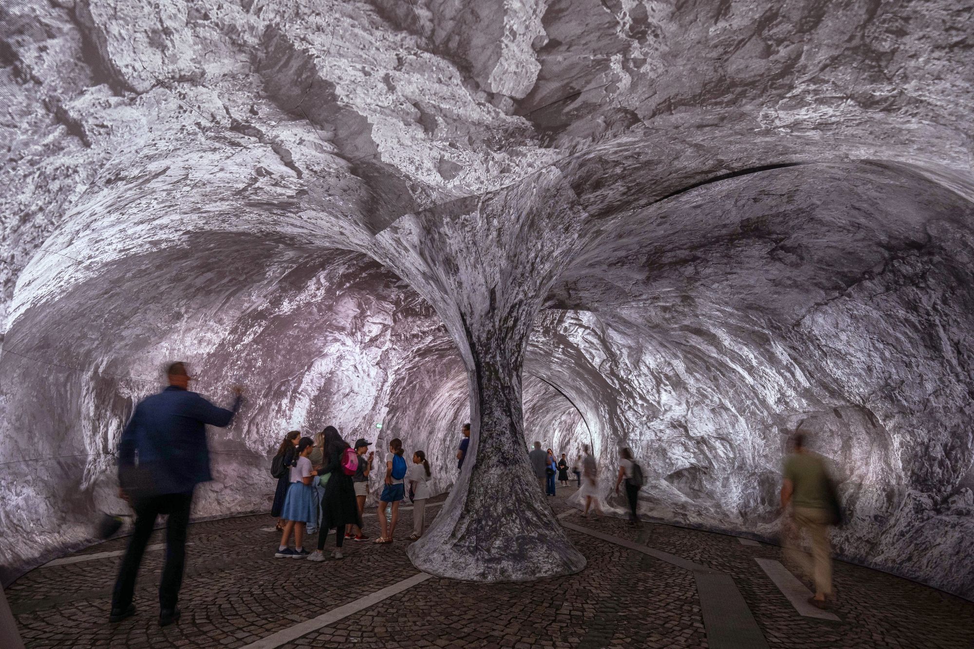 Made largely from printed fabric and air, the installation transforms the 17th-century bridge into an artificial cavern