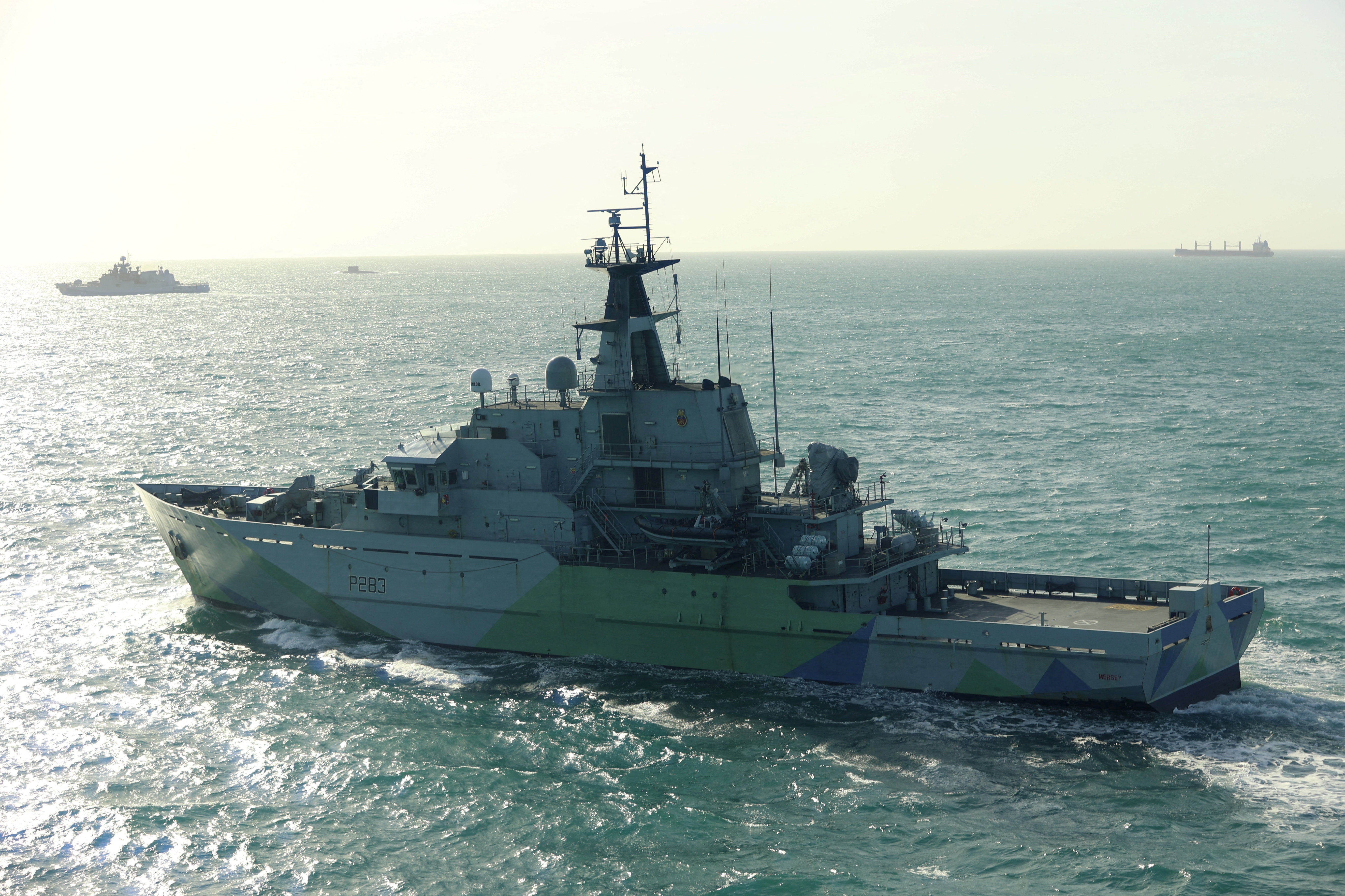 The British Royal Navy's HMS Mersey tracks the Russian Navy's Admiral Grigorovich frigate and Krasnodar submarine at an unknown location, in this undated handout image