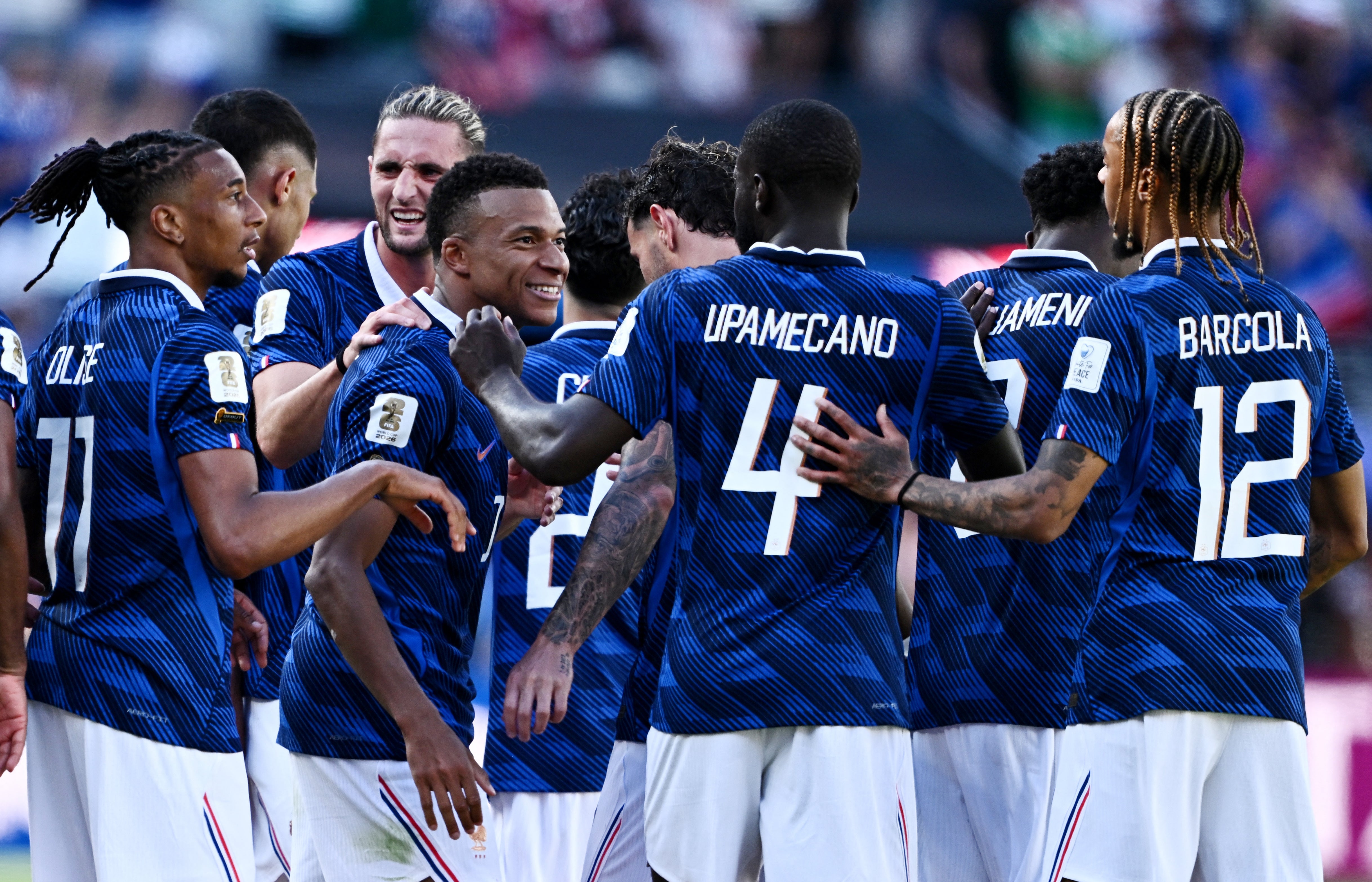 France's Kylian Mbappe celebrates scoring their third goal with Dayot Upamecano, Bradley Barcola, Adrien Rabiot, Michael Olise and teammates