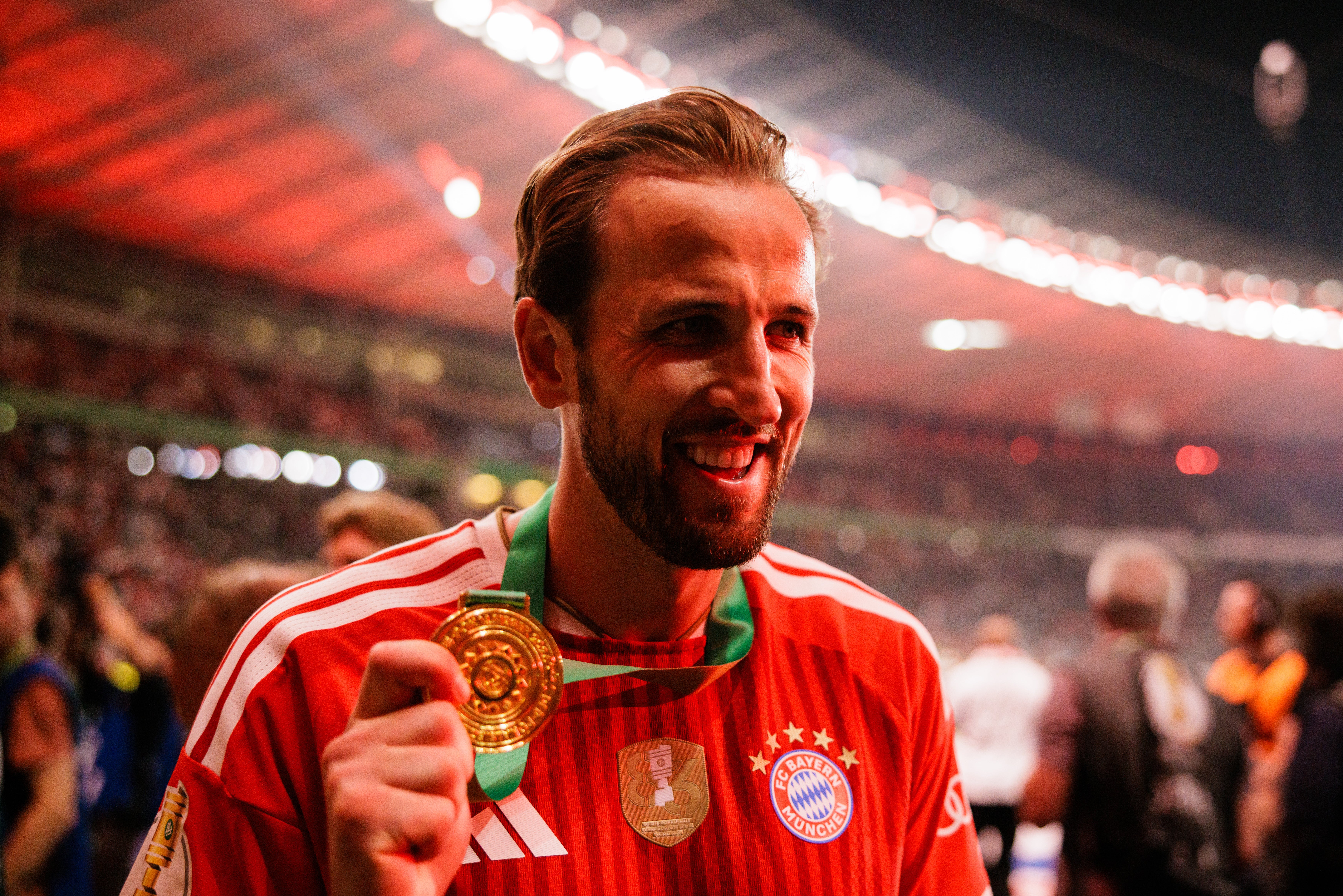 Kane shows off his medal after the DFB Cup final