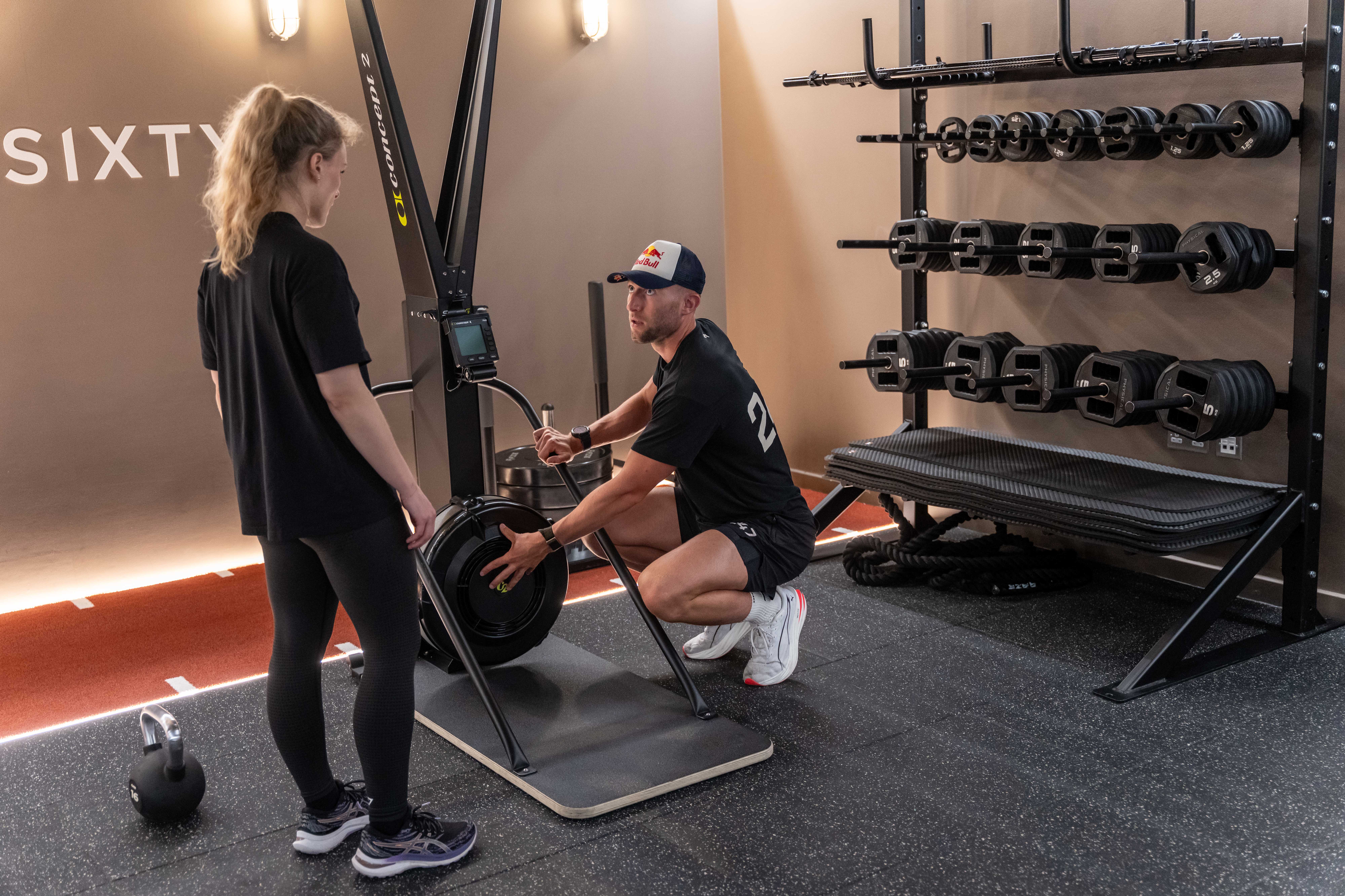 Dearden explaining the SkiErg technique to Eleanor (Jeff Moore/PA)