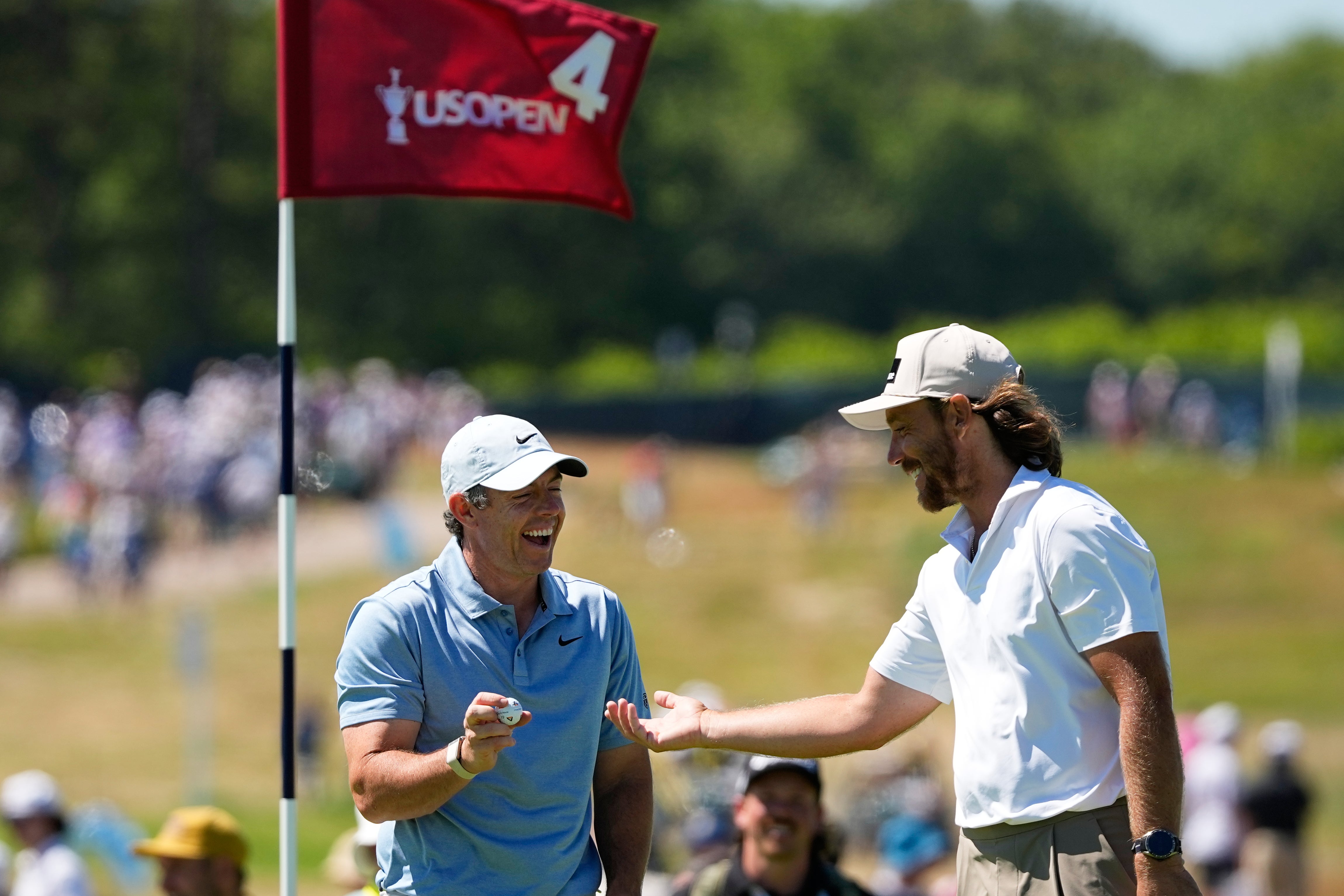 Rory McIlroy, left, tees off on Thursday morning with Ryder Cup team-mates Tommy Fleetwood, right, and Ludvig Aberg (David J. Phillip/AP) (AP)