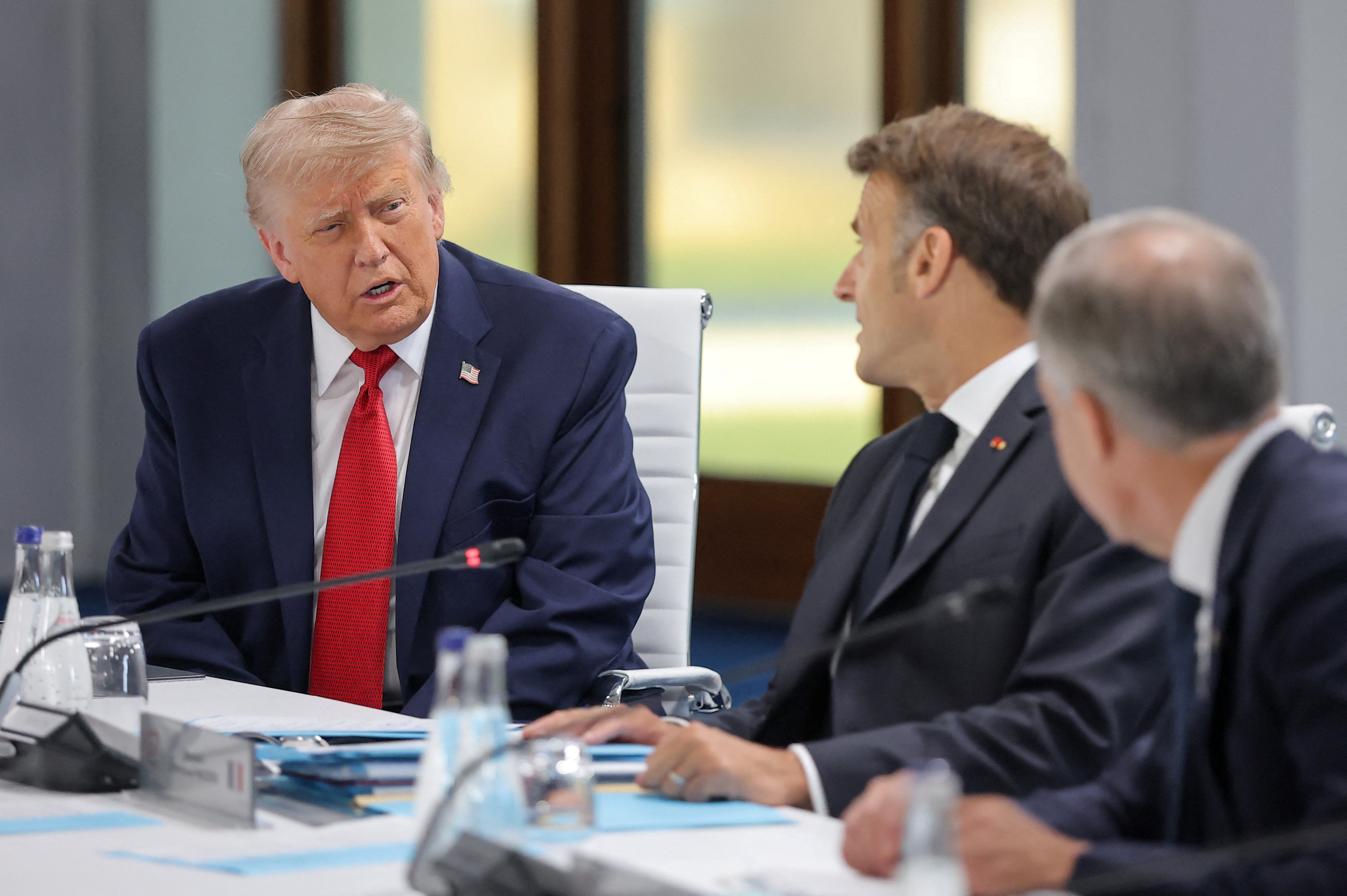 Donald Trump and French President Emmanuel Macron attend a working session with G7 leaders (Reuters)