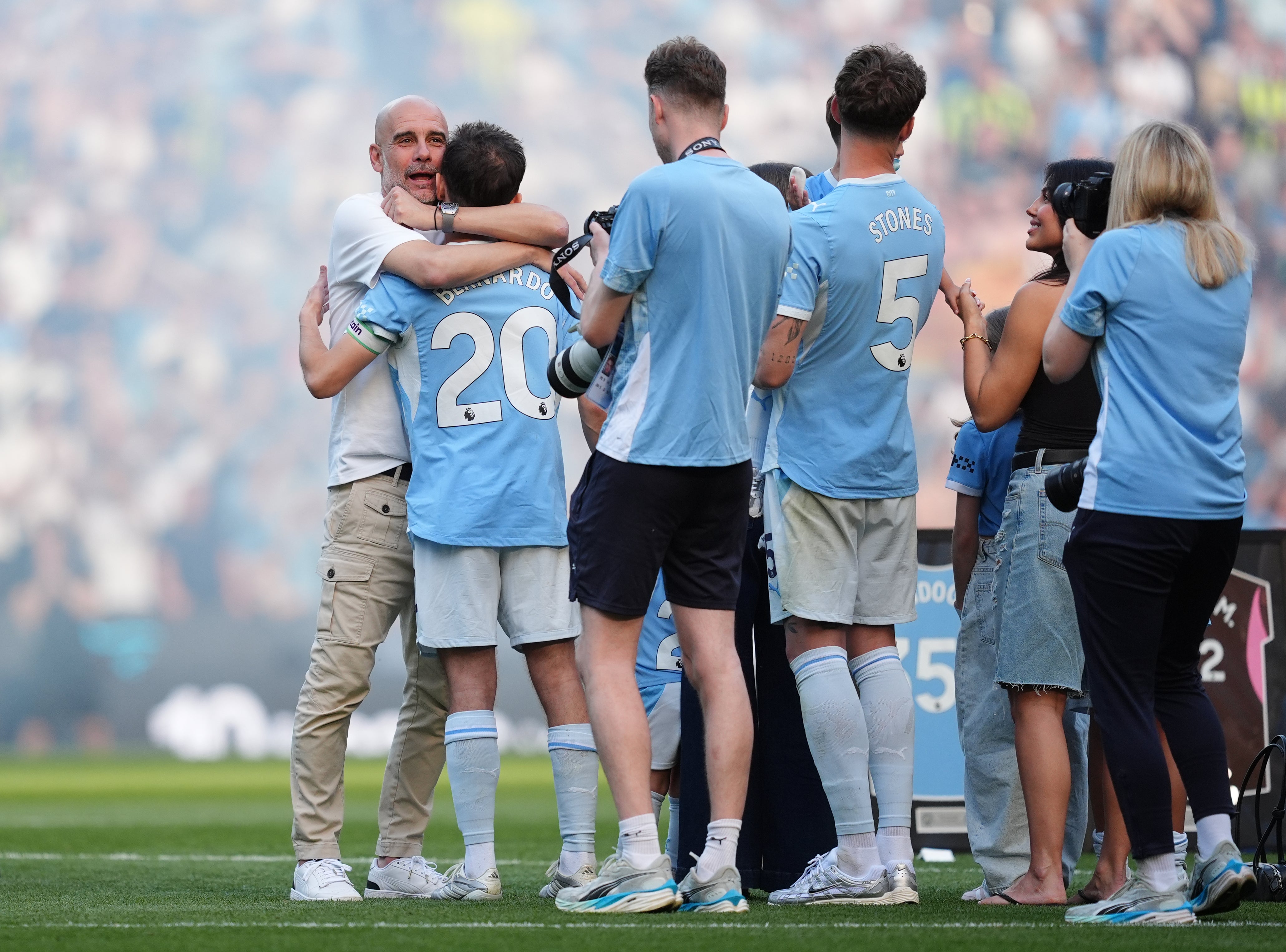 Pep Guardiola embraces Silva following their final match together (Martin Rickett/PA)