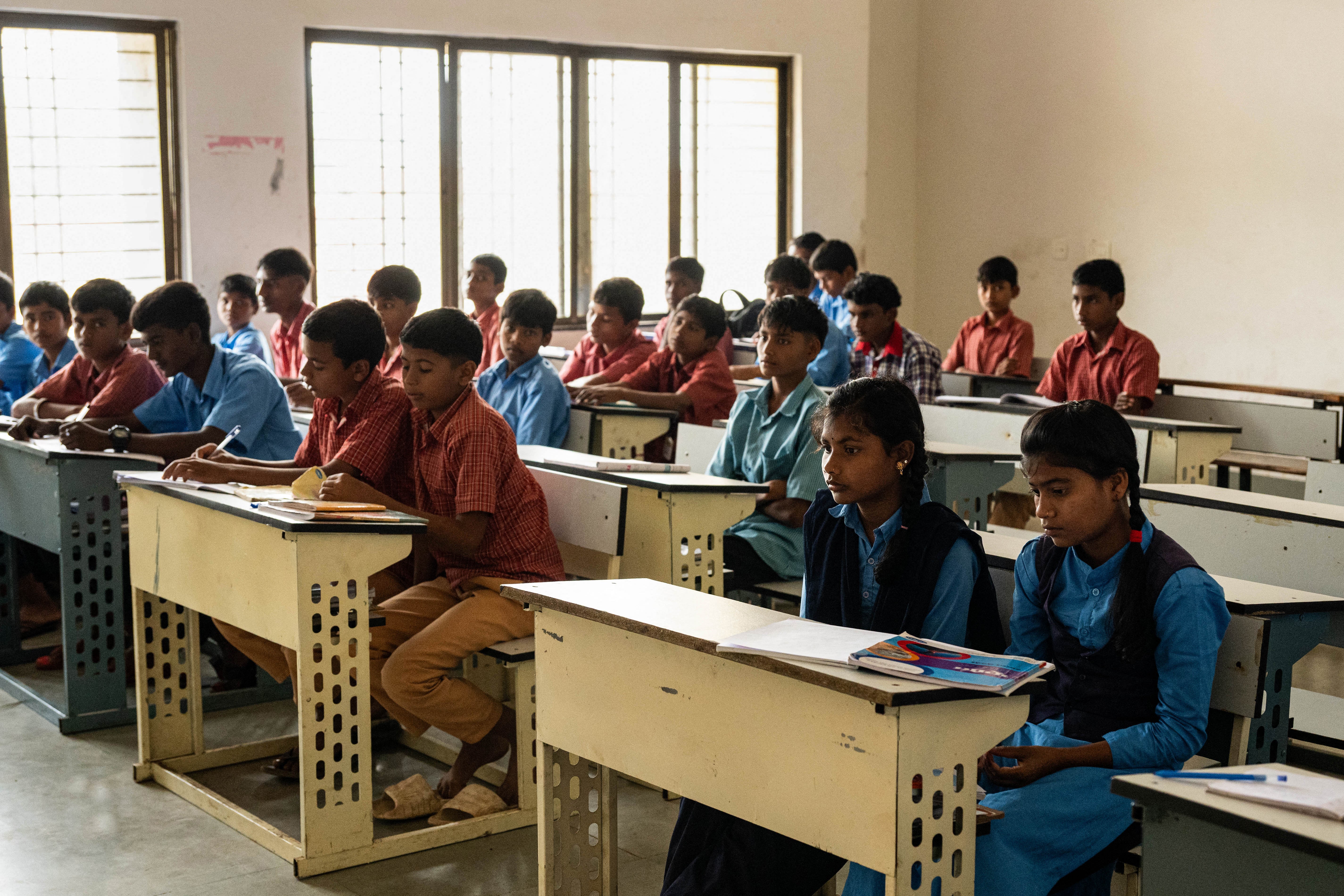 Children attend a class at the government-run Netaji Subhas Chandra Bose residential school that houses tribal students from drought-ridden villages