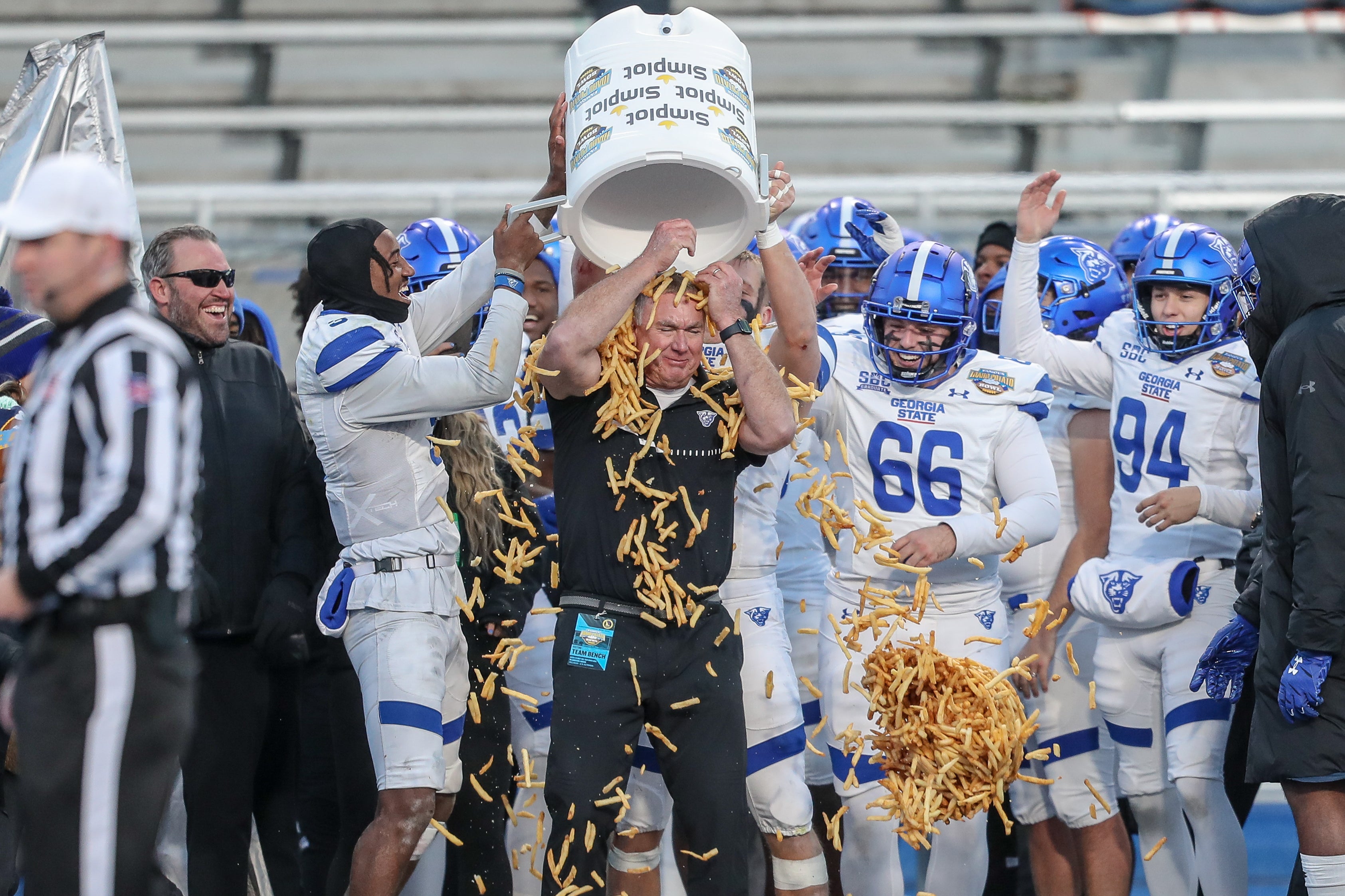 Georgia State University Head Coach Shawn Elliot is showered by French fries during the Famous Idaho Potato Bowl in Boise, Idaho, in December 2023. Frying potatoes produces a carcinogen, known as acrylamide