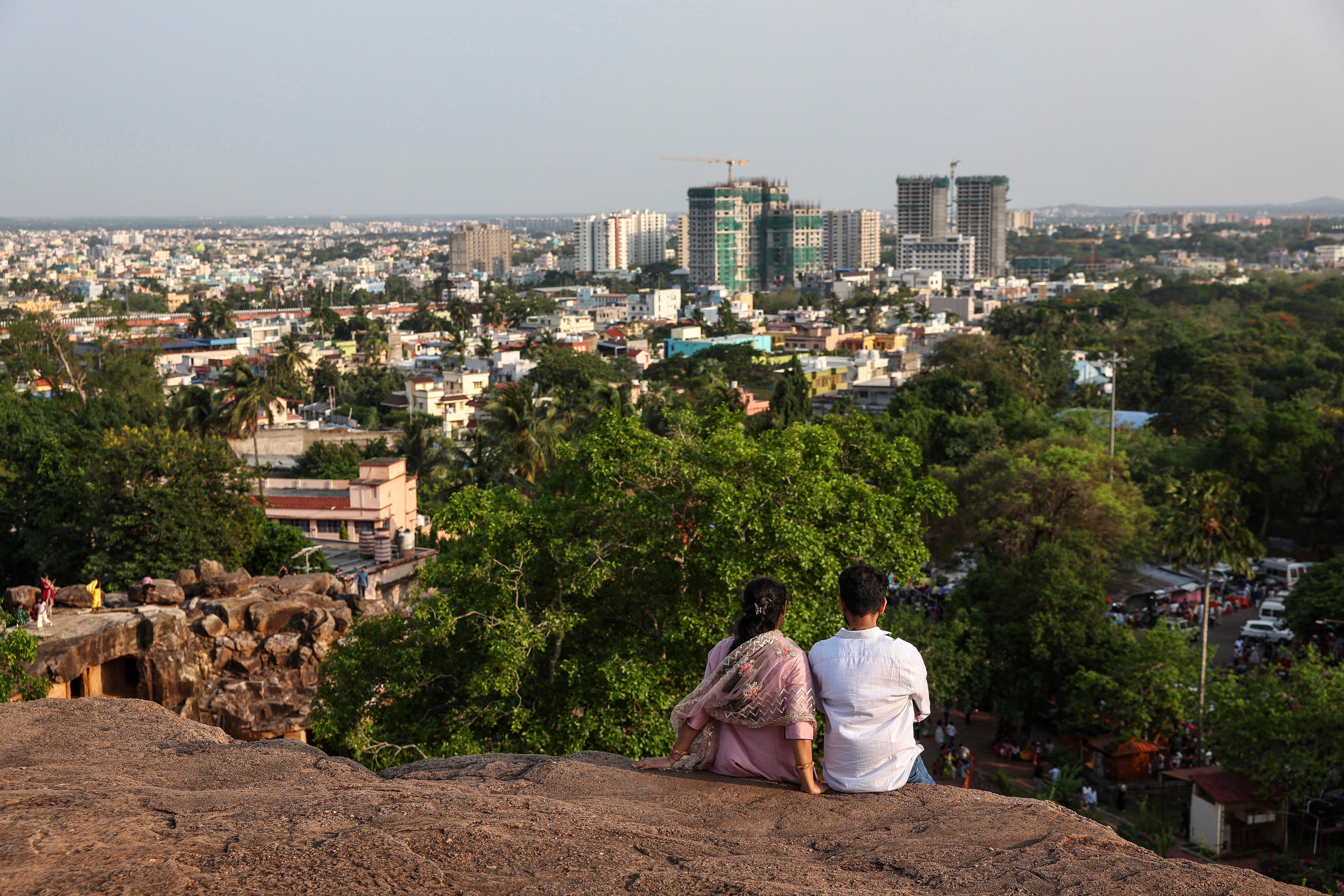 A couple looks at the city view while visiting the Udayagiri and Khandagiri Caves in Bhubaneswar on 3 May 2026