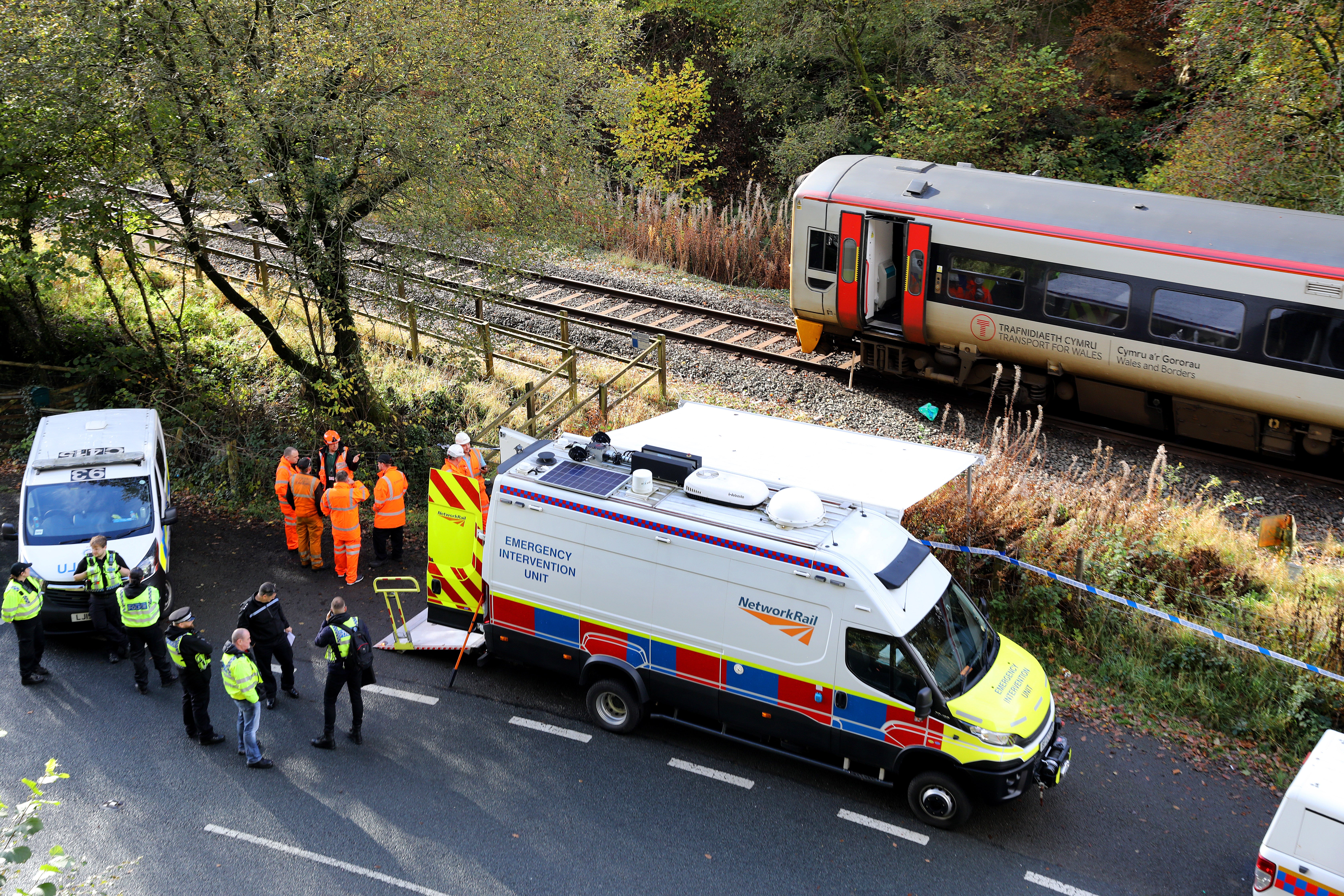 Emergency workers at the scene after the collision involving two trains near Llanbrynmair, mid Wales, in 2024