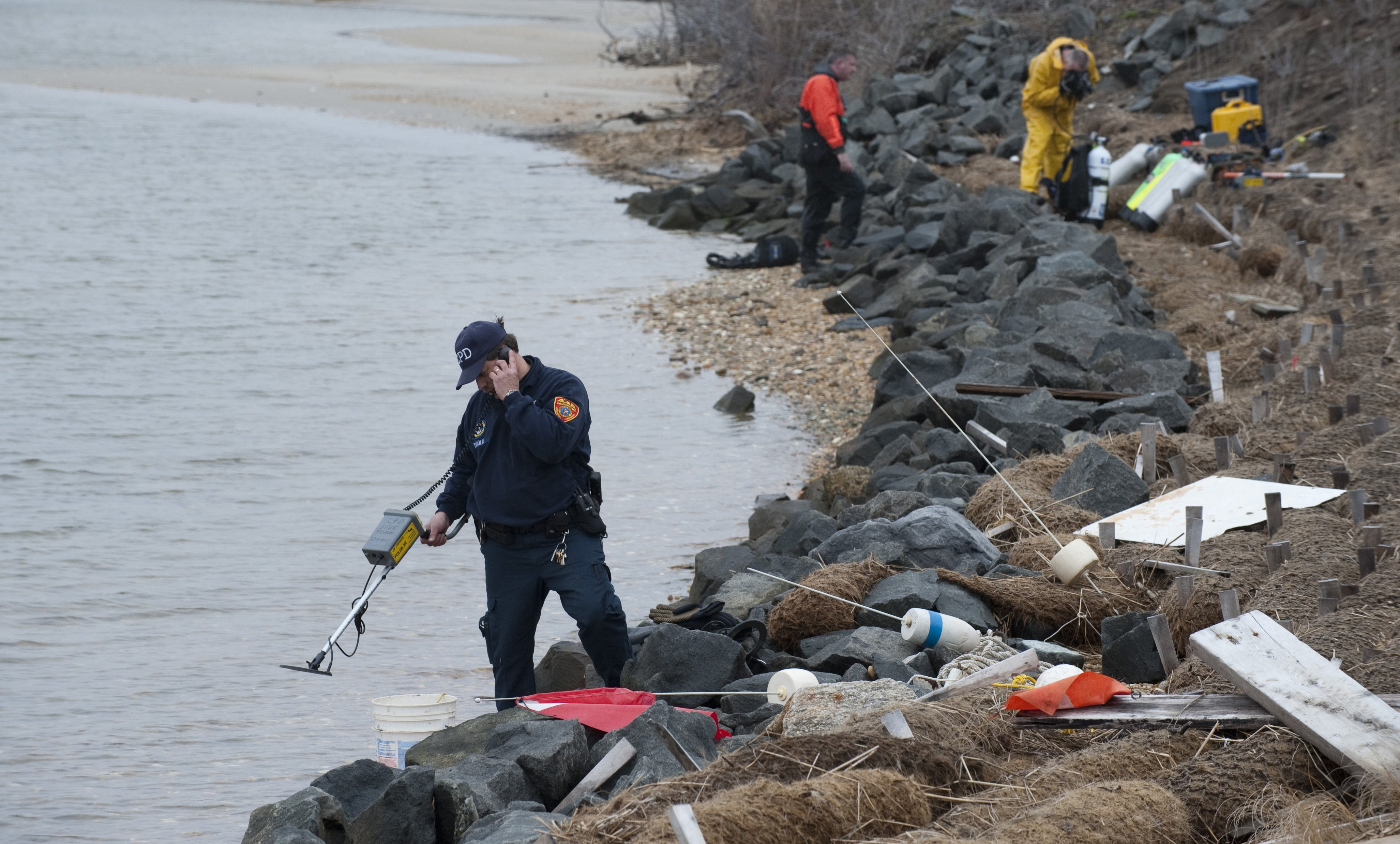 Police divers prepare to search for human remains in Hemlock Cove in Gilgo, N.Y., on April 13, 2011, during an investigation that later led to Heuermann’s arrest and guilty plea for eight killings