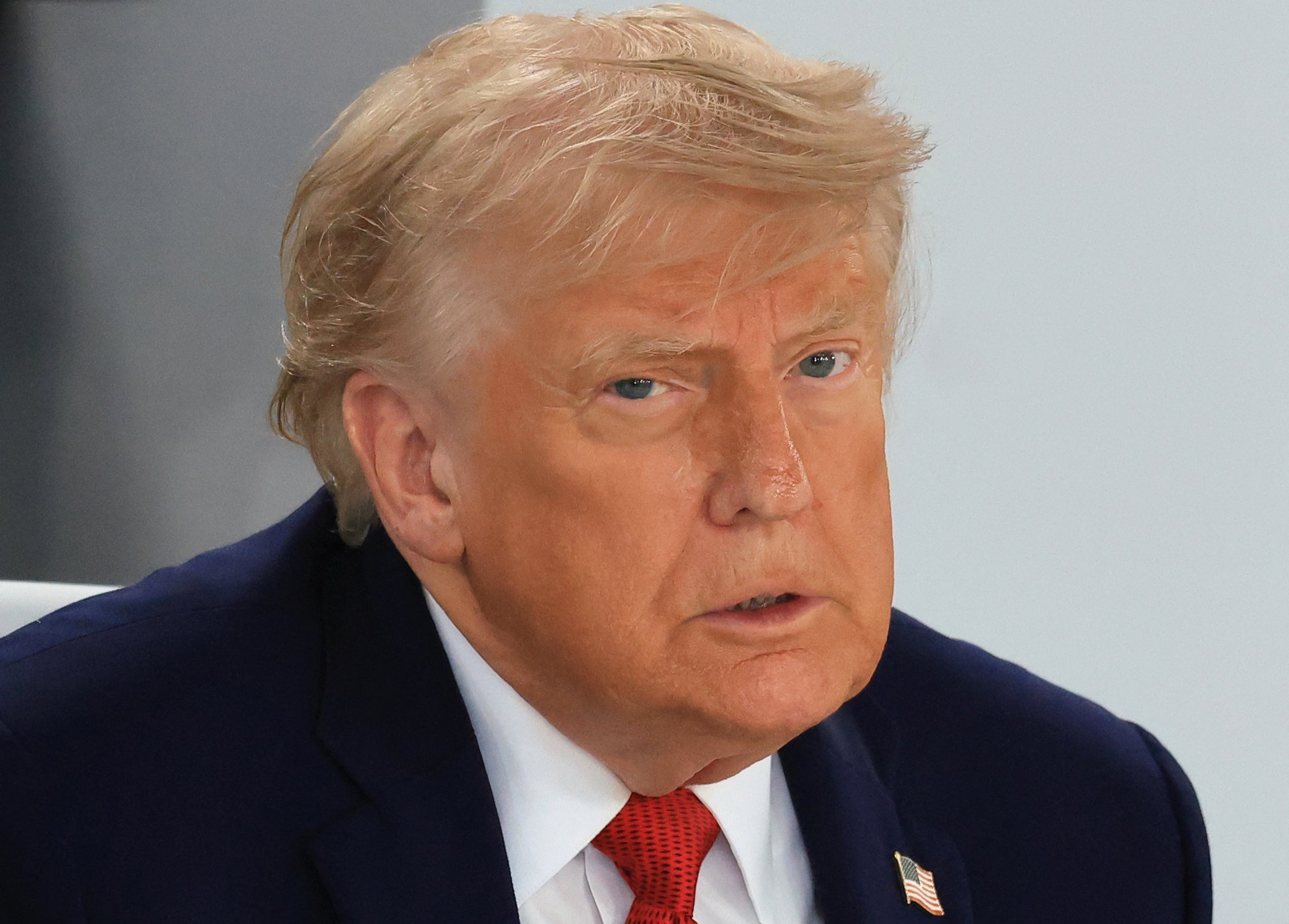 President Donald Trump reacts during a working lunch meeting of G7 members, partner countries, and artificial intelligence business leaders as part of the G7 summit, in Evian, eastern France, on June 17