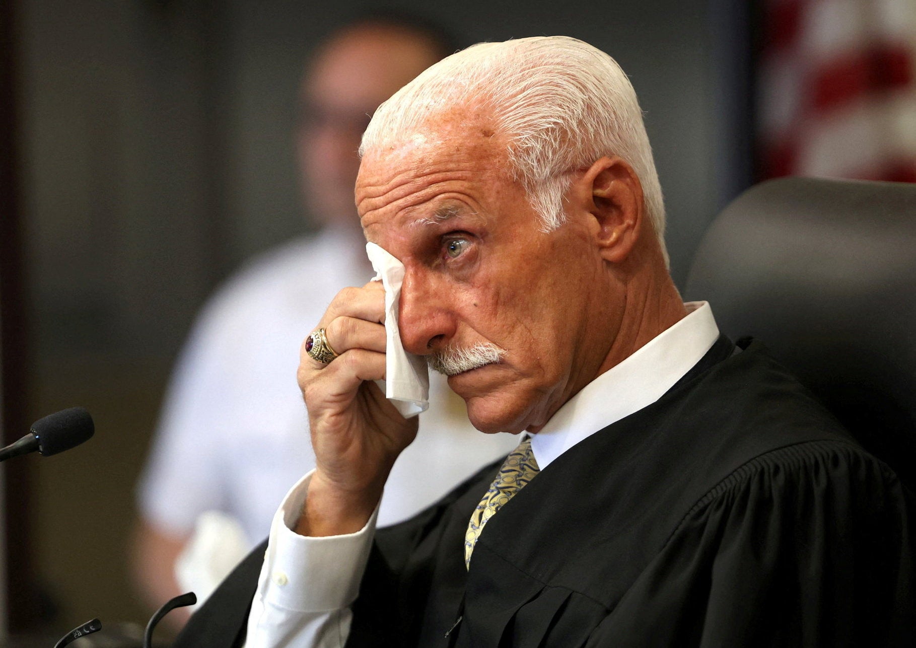 Judge Timothy Mazzei wipes away tears while listening to a victim impact statement (Reuters)