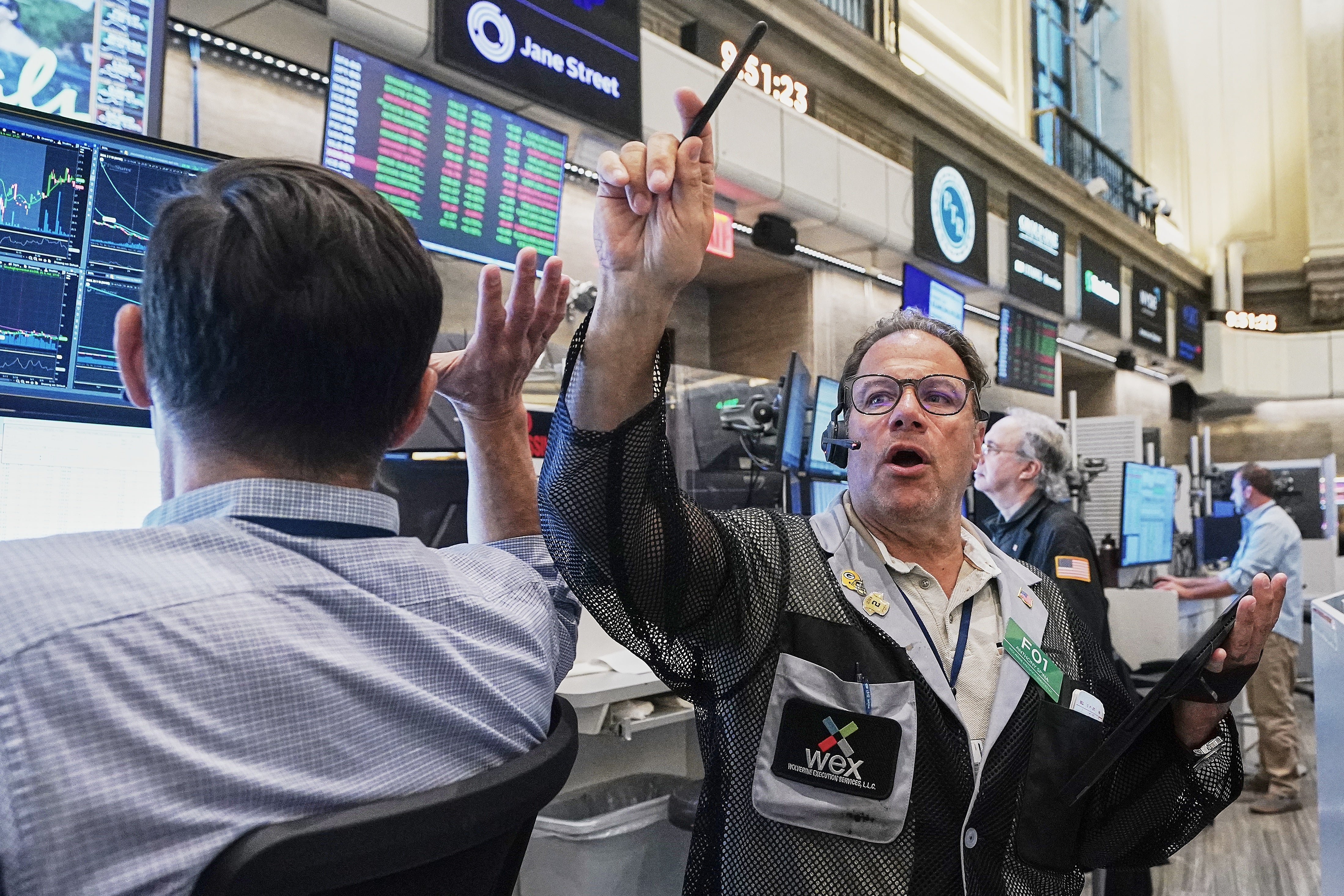 Options trader Anthony Spina, center, works on the floor of the New York Stock Exchange as markets tumbled on Tuesday, June 16, 2026