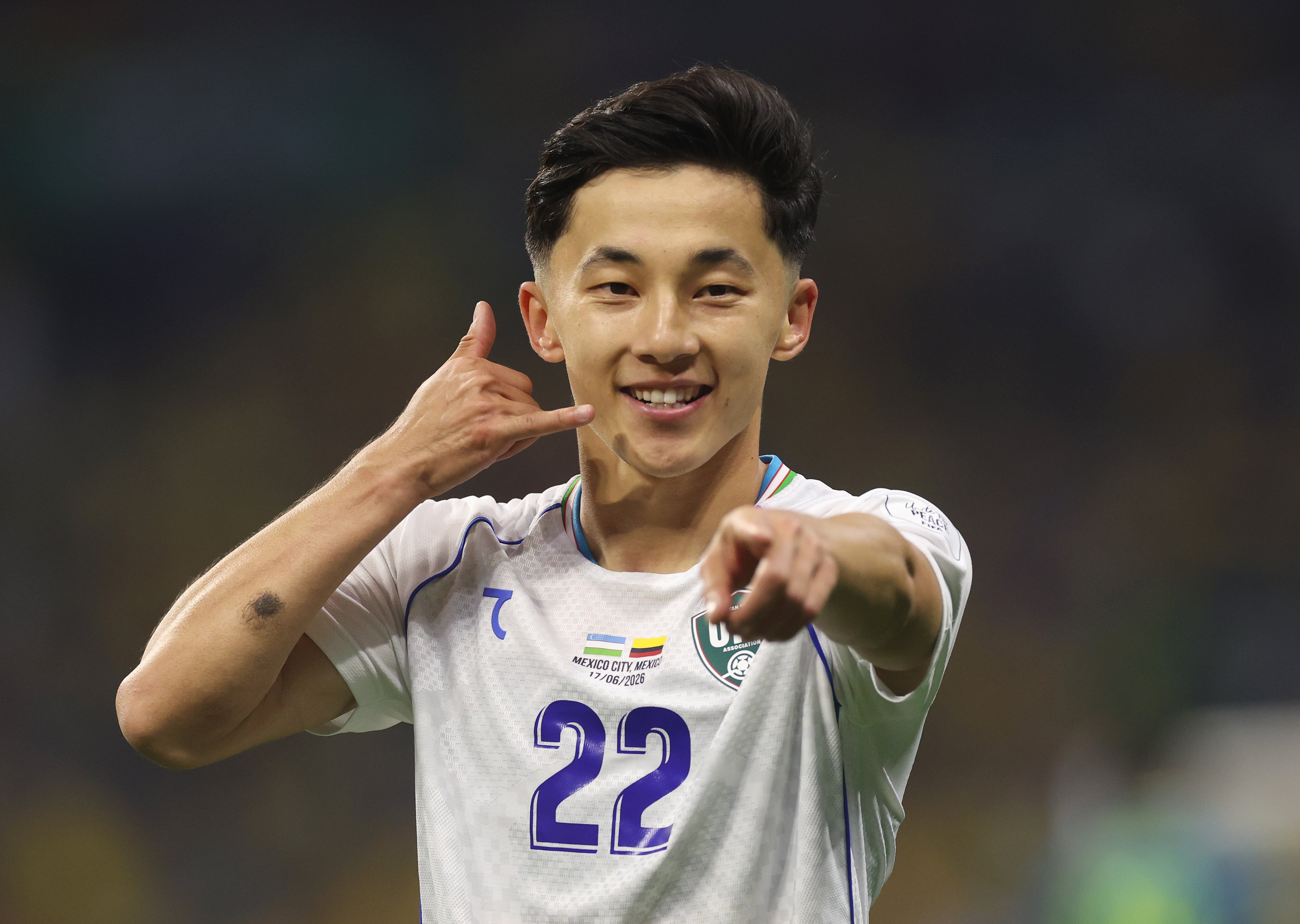 Abbosbek Fayzullaev of Uzbekistan celebrates scoring