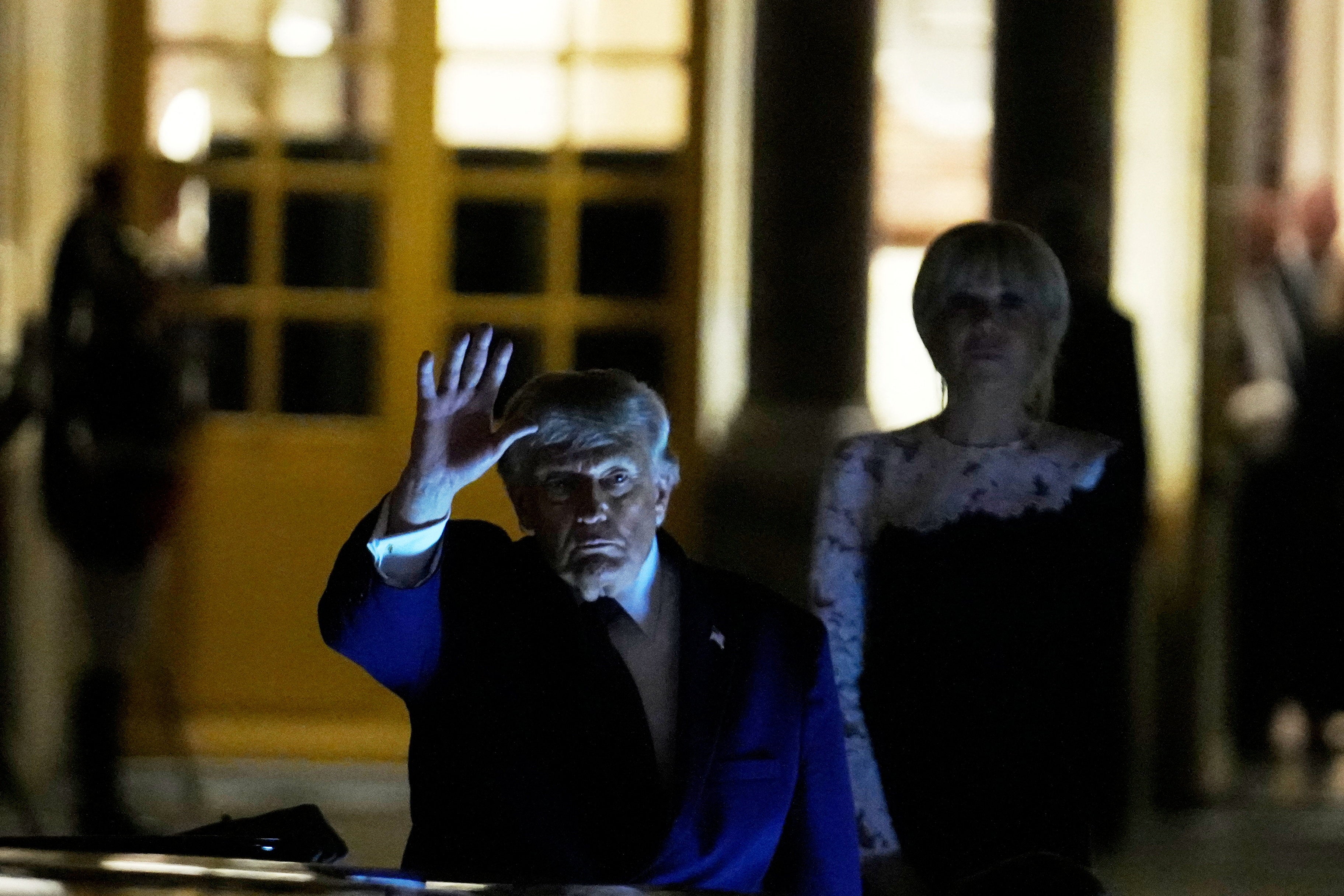 Donald Trump departs after the dinner at the Palace of Versailles, early Thursday (Reuters)