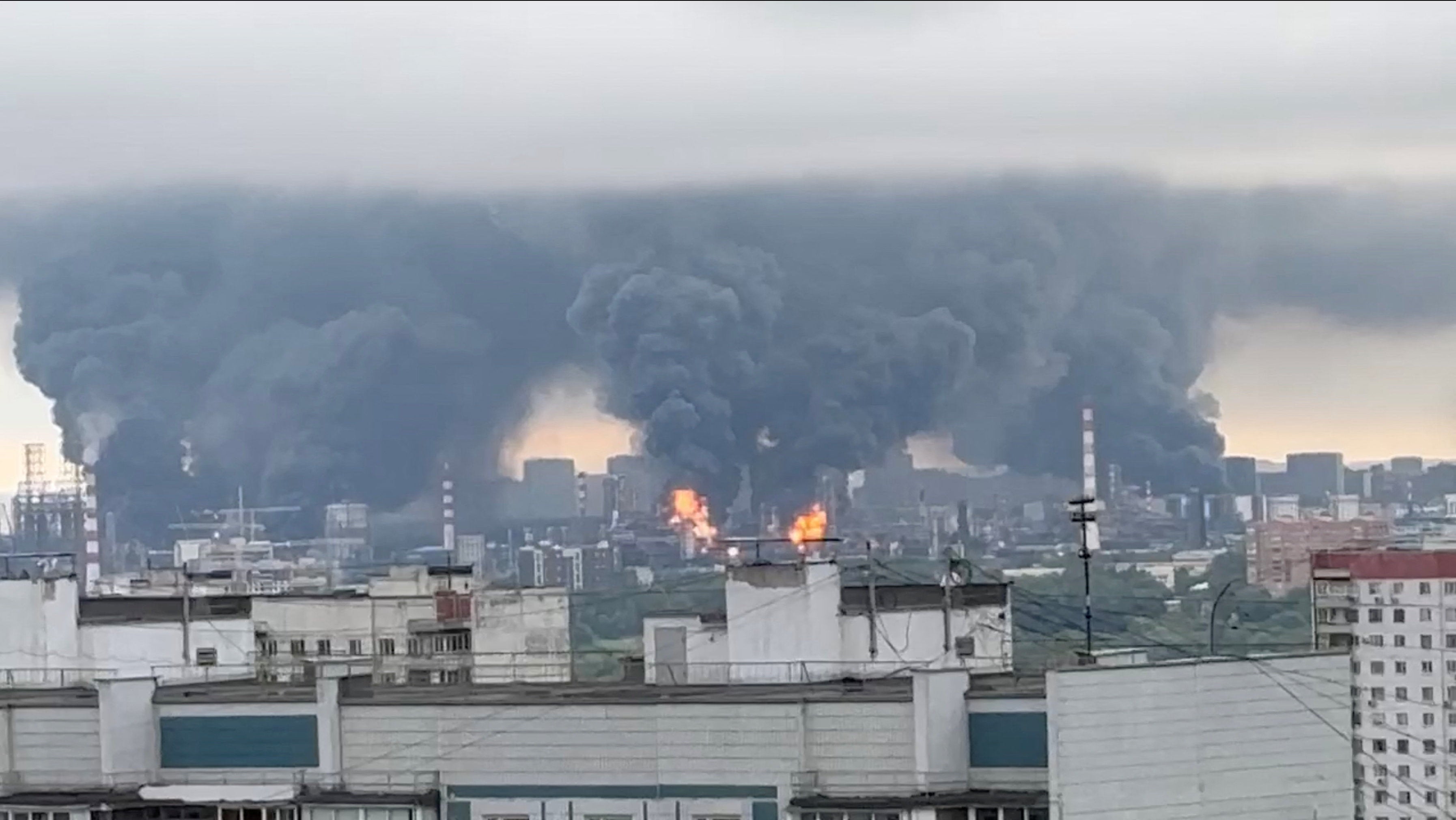 Thick plumes of smoke with flames rise from an oil refinery in Moscow (Reuters)
